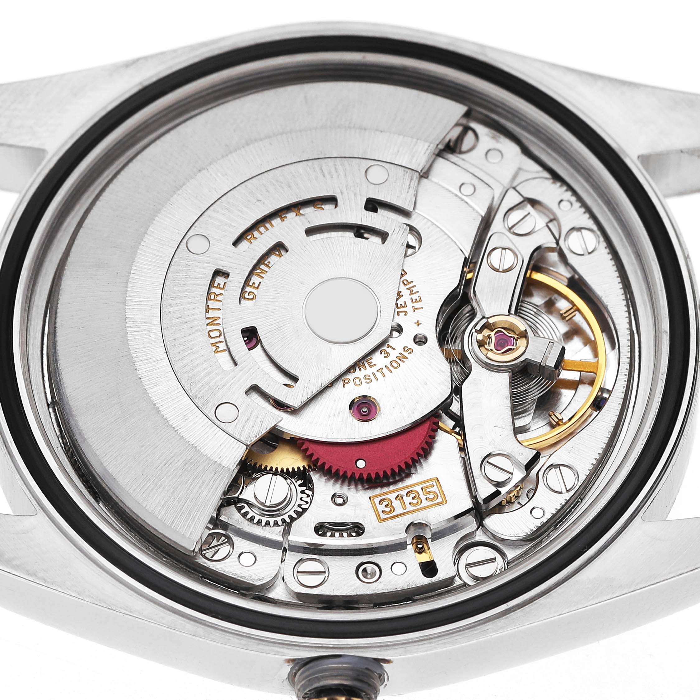 The image shows the movement of a Rolex Datejust 16233 Men's Steel and Gold (two tone) Silver Dial watch from a top-down angle, highlighting its intricate mechanical components.