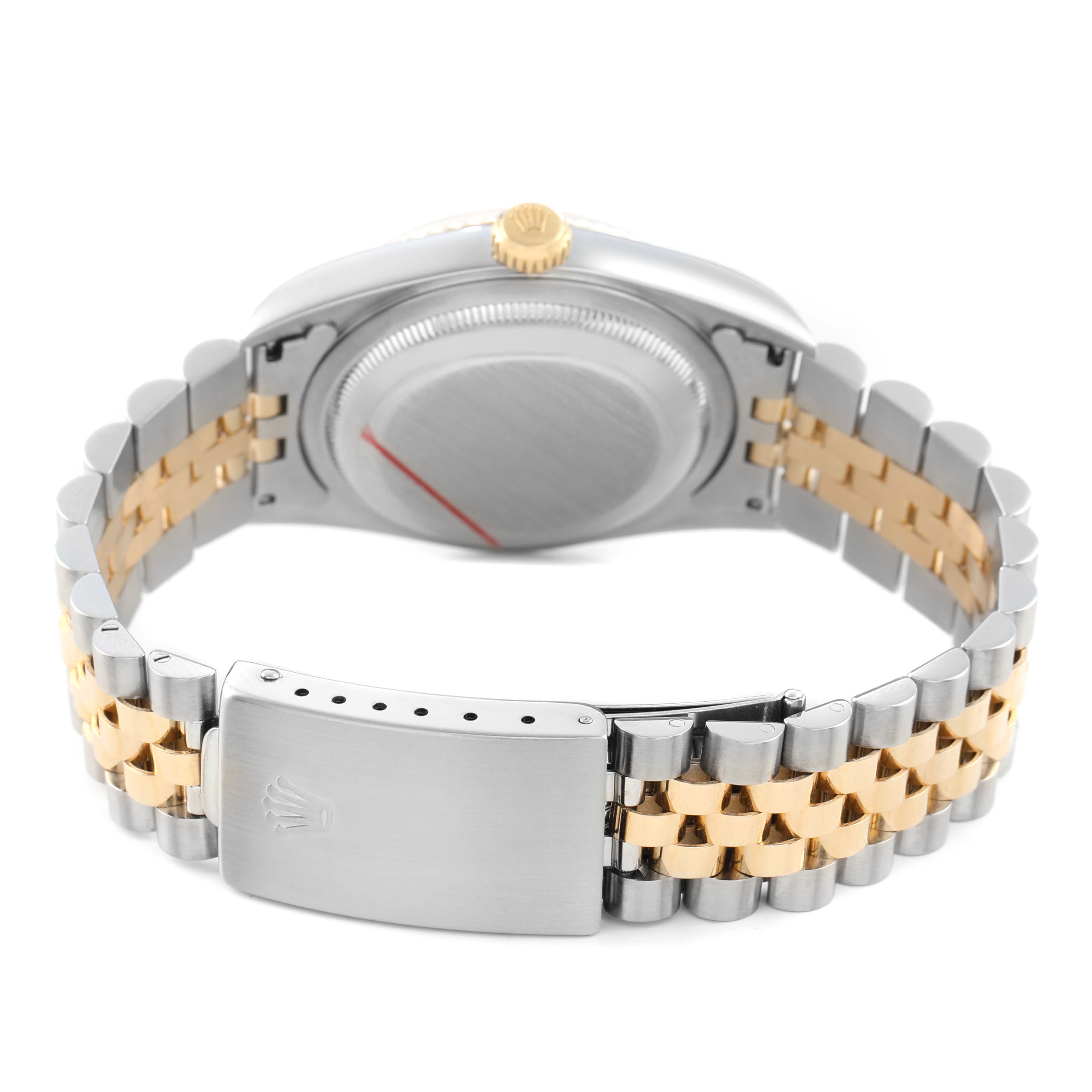 The image shows the back of a Rolex Datejust 16233 Men's Steel and Gold (two tone) Silver Dial watch, highlighting its bracelet and clasp, with the watch case and crown visible.