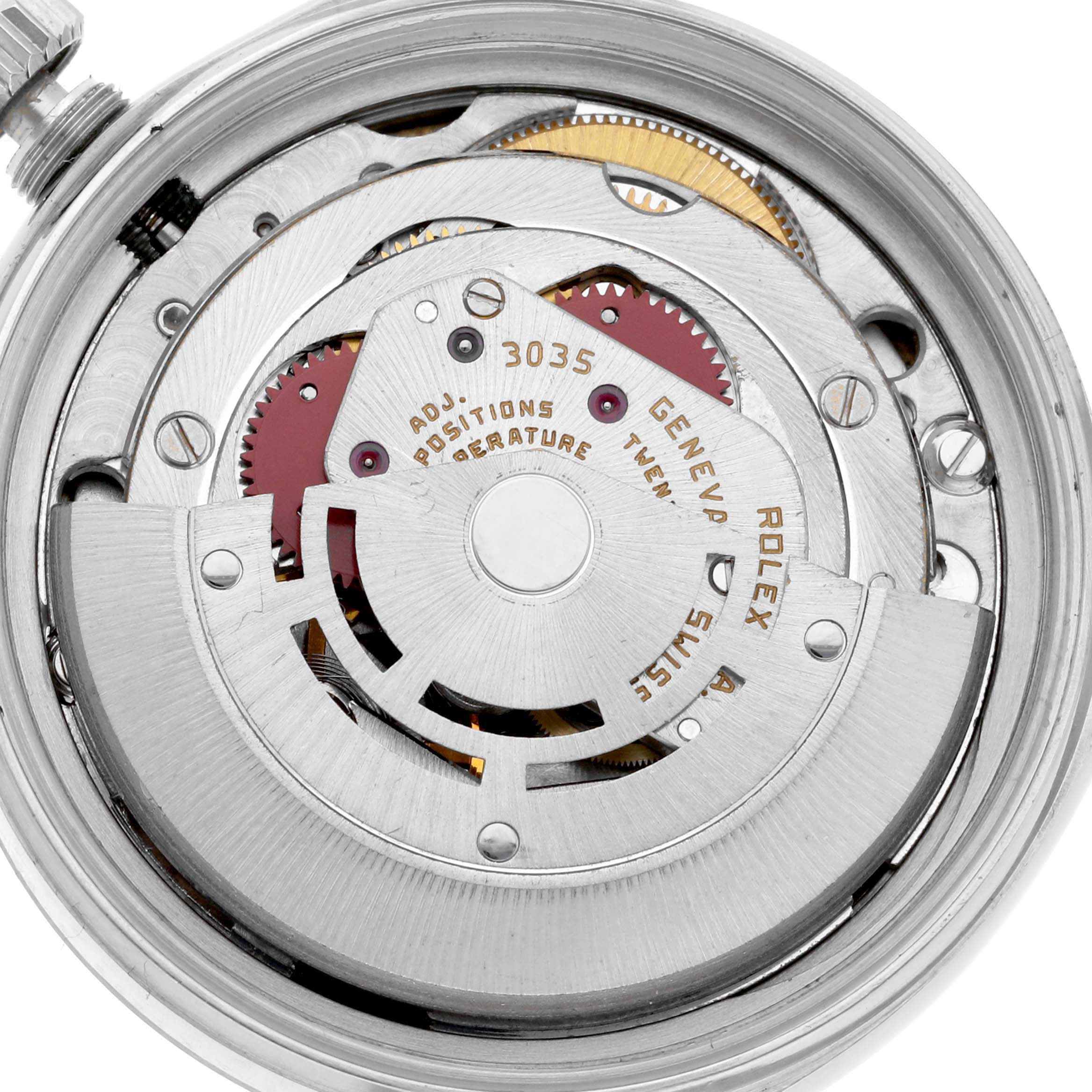 The image shows a close-up of the Rolex Datejust 16014 Men's Stainless Steel Silver Dial 16014 Men's Stainless Steel Silver Dial's movement, highlighting the intricate mechanical parts.