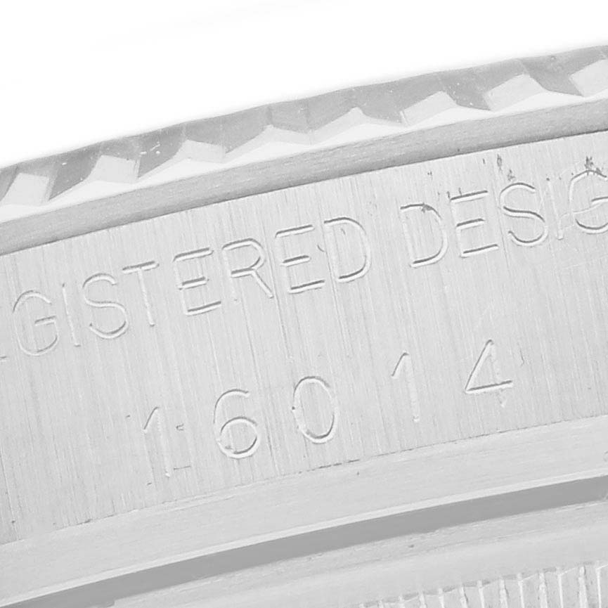 The image shows a side view of the engraved case back of a Rolex Vintage Collection 16014 Men's Stainless Steel Silver Dial 16014 Men's Stainless Steel Silver Dial watch.