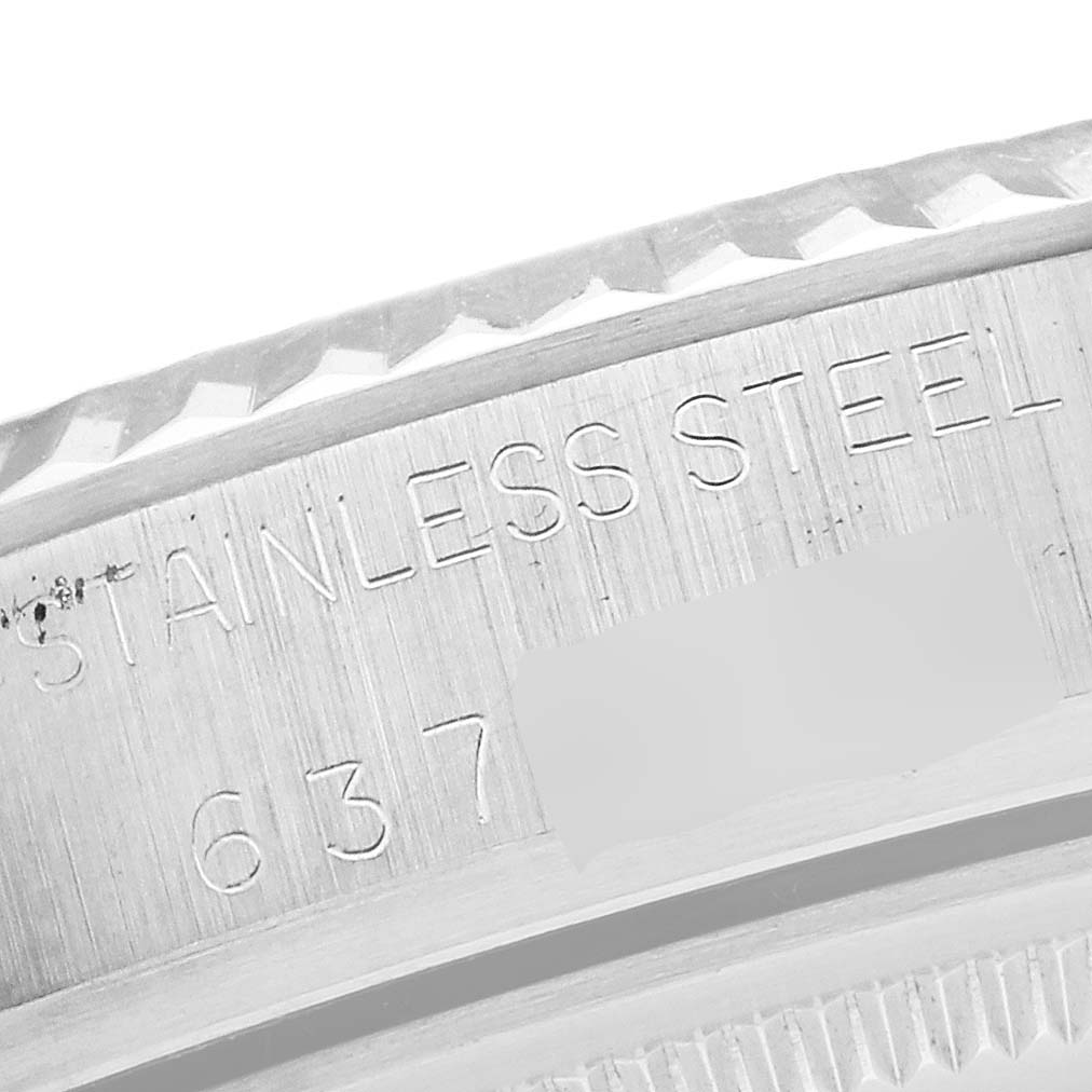 The image shows a close-up of the Rolex Vintage Collection 16014 Men's Stainless Steel Silver Dial 16014 Men's Stainless Steel Silver Dial watch's stainless steel case back with part of the engraved serial number.