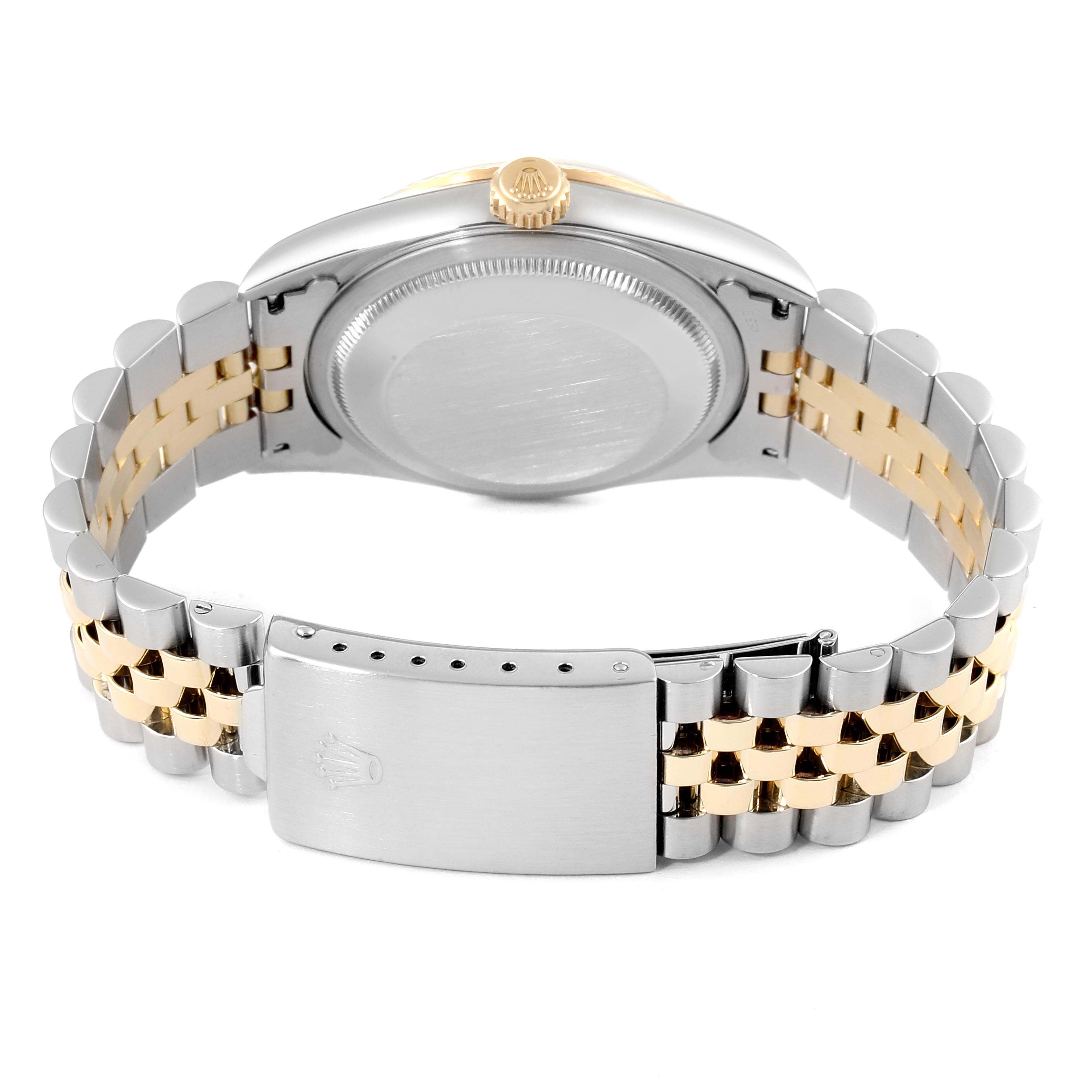 This image shows the back and clasp of a Rolex Datejust 16233 Men
s Steel and Gold (two tone) Mother of Pearl Dial 16233 Men
s Steel and Gold (two tone) Mother of Pearl Dial watch, highlighting its two-tone bracelet and crown.