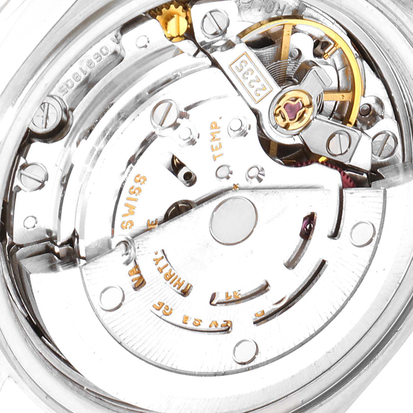 This image shows the intricate internal movement of the Rolex Datejust 79173 Women's Steel and Gold (two tone) Red Dial 79173 Women's Steel and Gold (two tone) Red Dial watch mechanism.