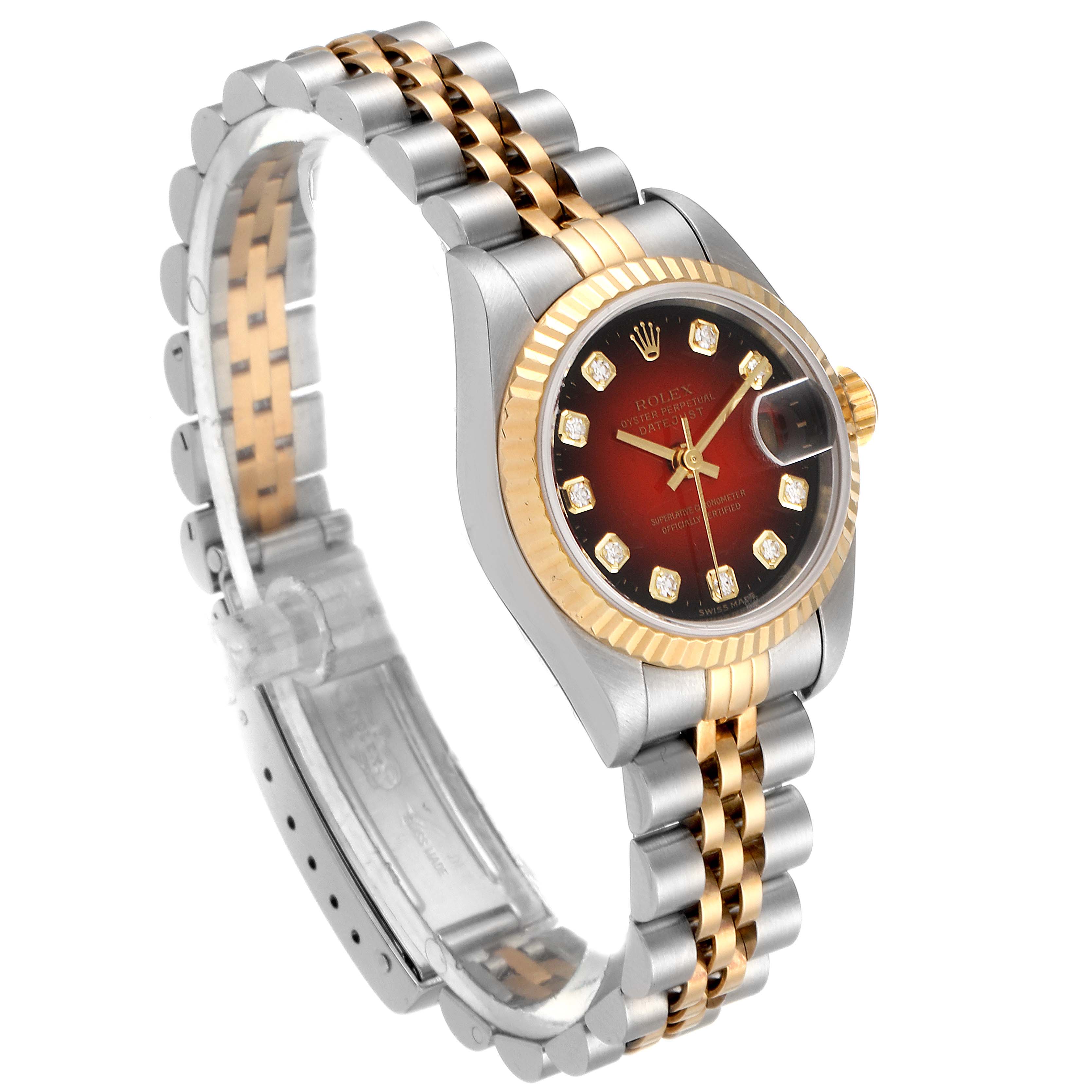 The Rolex Datejust 79173 Women's Steel and Gold (two tone) Red Dial 79173 Women's Steel and Gold (two tone) Red Dial model is shown at an angle highlighting its jubilee bracelet, bezel, and dial with diamond markers.