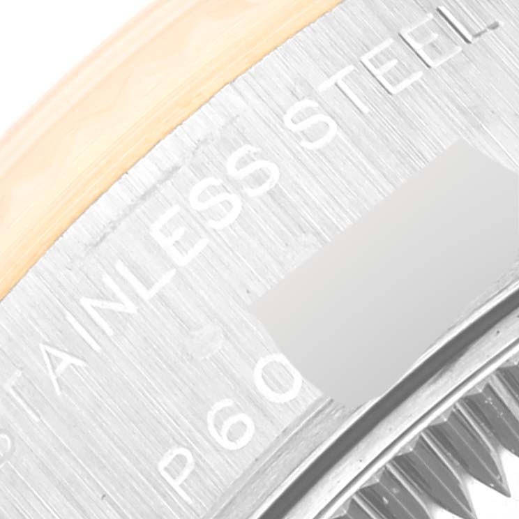 Close-up shot of the Rolex Datejust 79173 Women's Steel and Gold (two tone) Silver Dial 79173 Women's Steel and Gold (two tone) Silver Dial watch, showing part of the bezel and the engraved "STAINLESS STEEL."