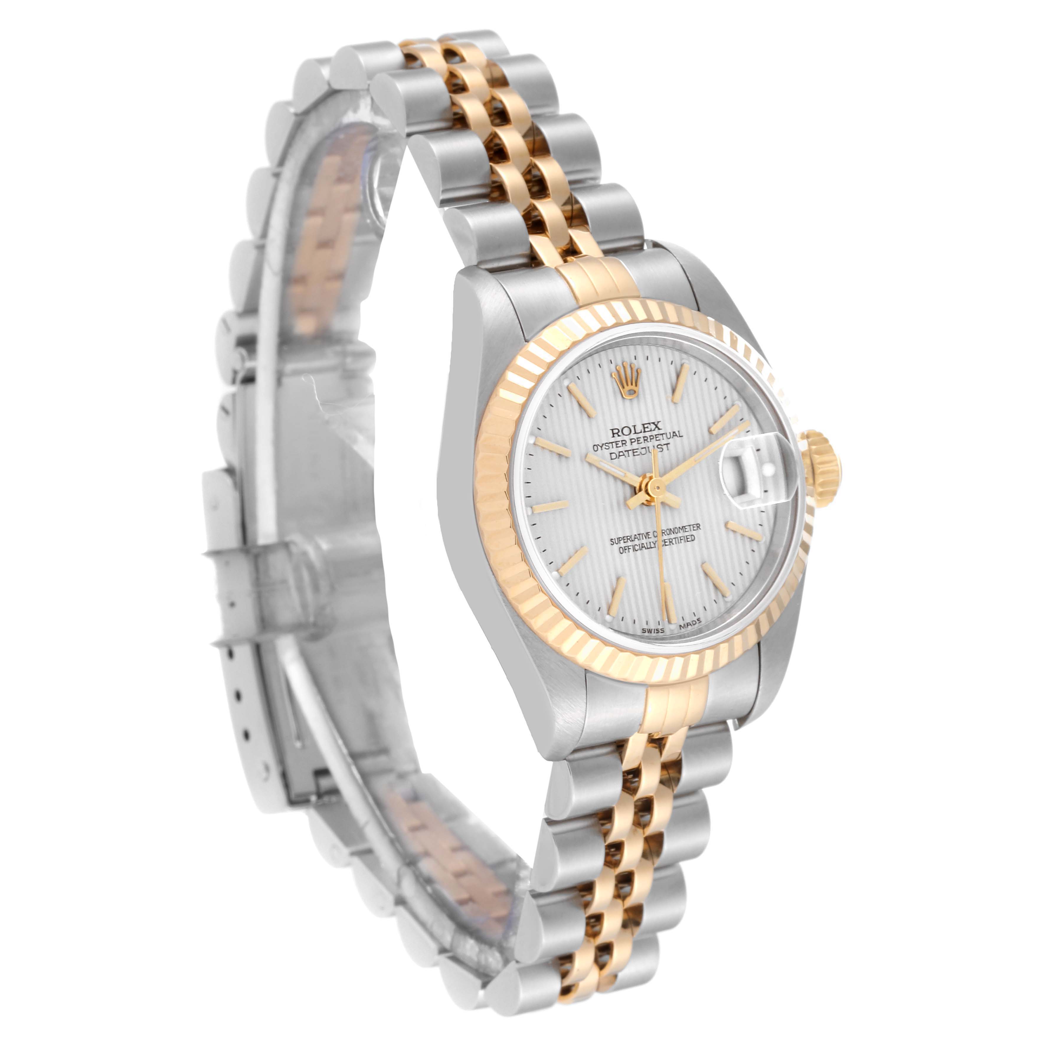 The Rolex Datejust 79173 Women's Steel and Gold (two tone) Silver Dial 79173 Women's Steel and Gold (two tone) Silver Dial watch is shown from a three-quarter angle, displaying its face, bezel, case, and two-tone bracelet.