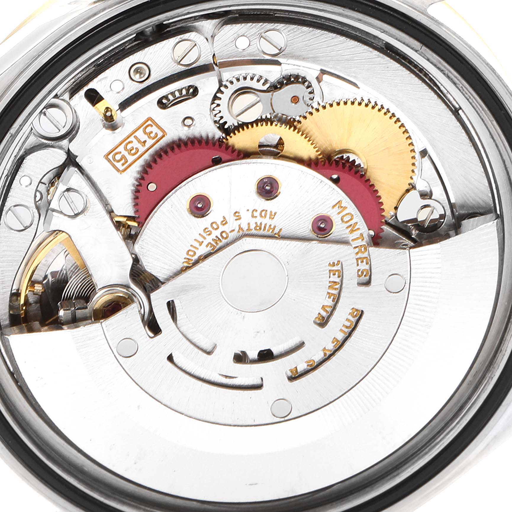This image shows the intricate internal mechanism and gears of a Rolex Datejust 16233 Men's Steel and Gold (two tone) White Dial 16233 Men's Steel and Gold (two tone) White Dial watch from a close-up, back angle.