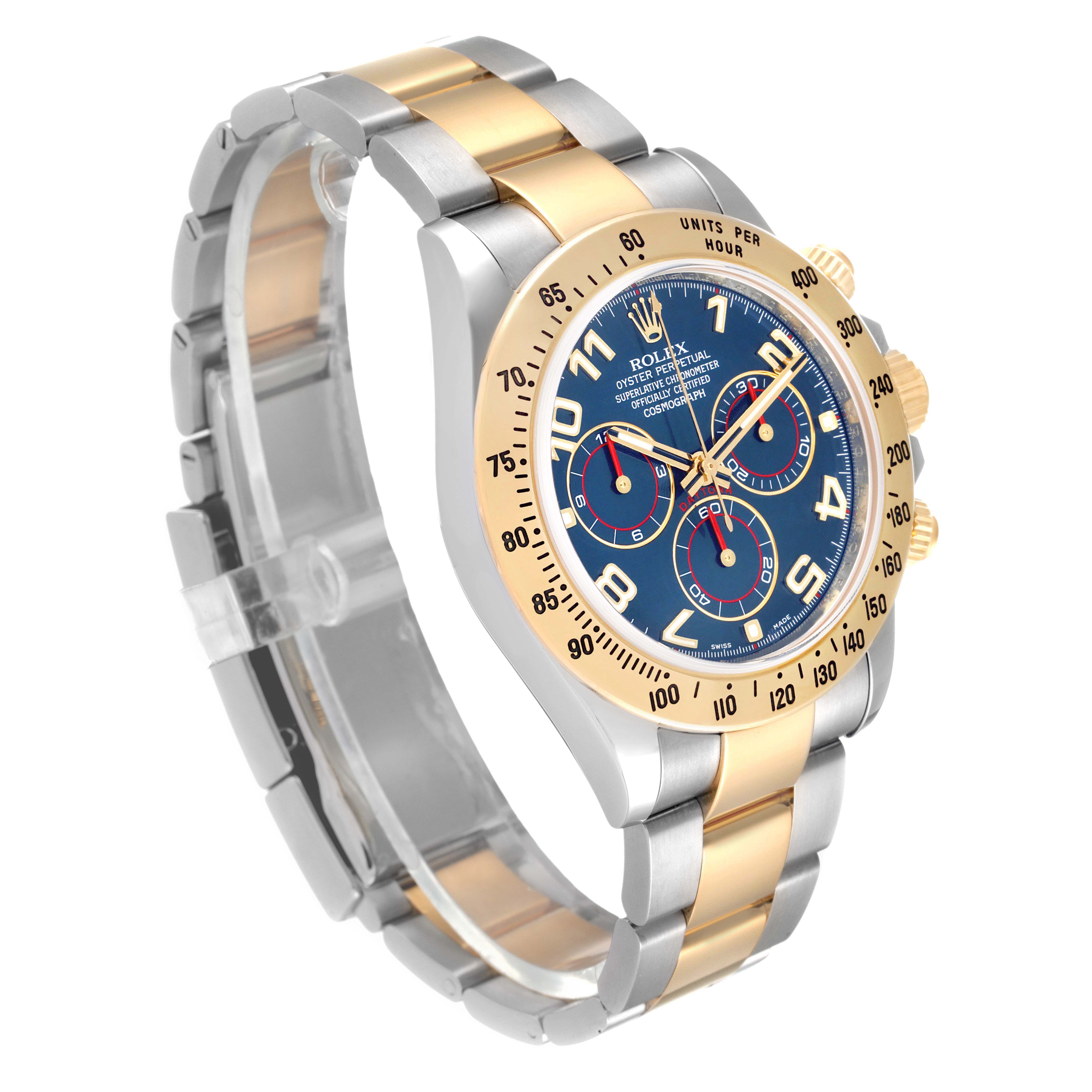 The Rolex Daytona 116523 Men's Steel and Gold (two tone) Blue Dial watch is shown at a three-quarter angle, highlighting the bezel, dials, and two-tone bracelet.