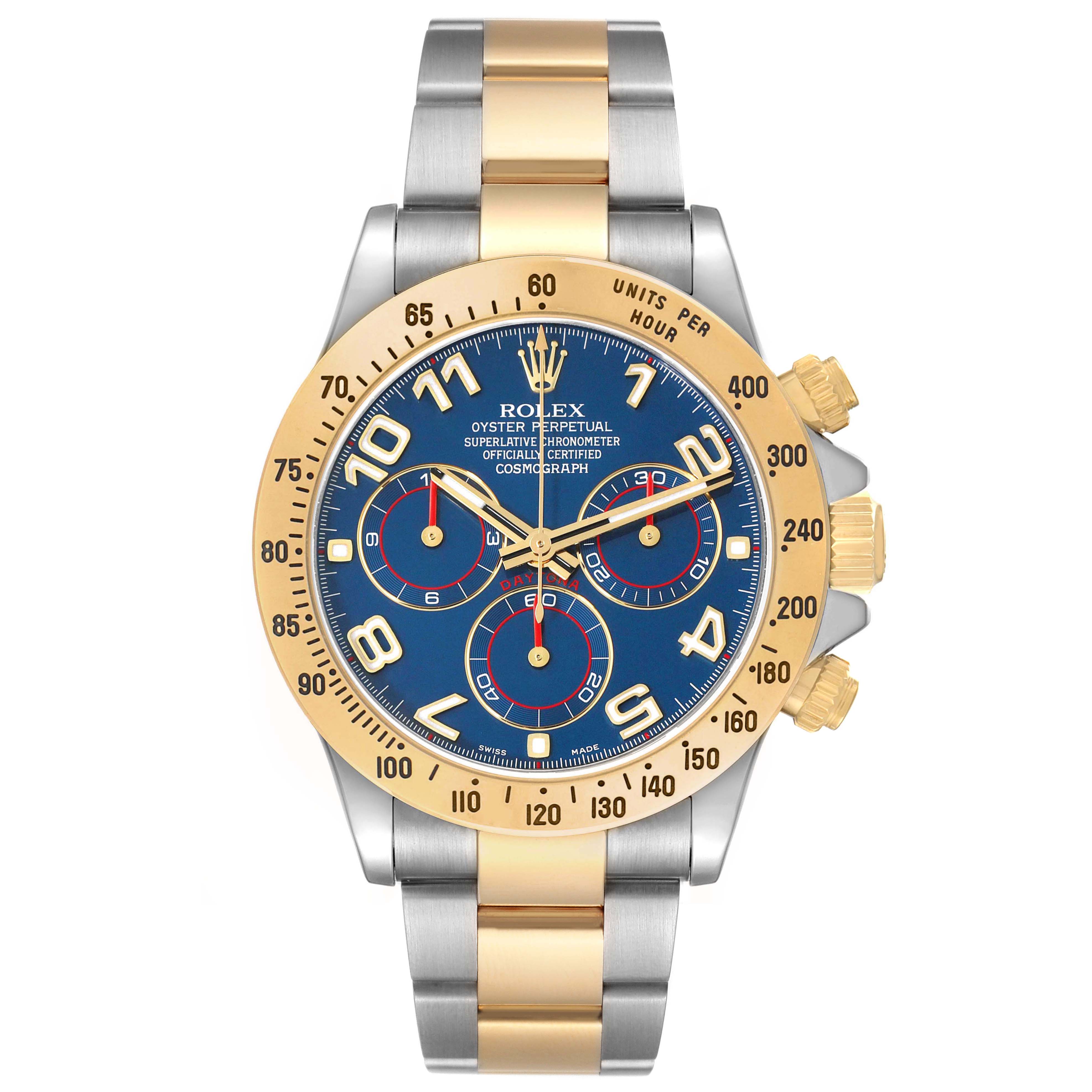 The Rolex Daytona 116523 Men's Steel and Gold (two tone) Blue Dial watch is shown from a front angle, highlighting its bezel, dial, crown, and two-tone bracelet.