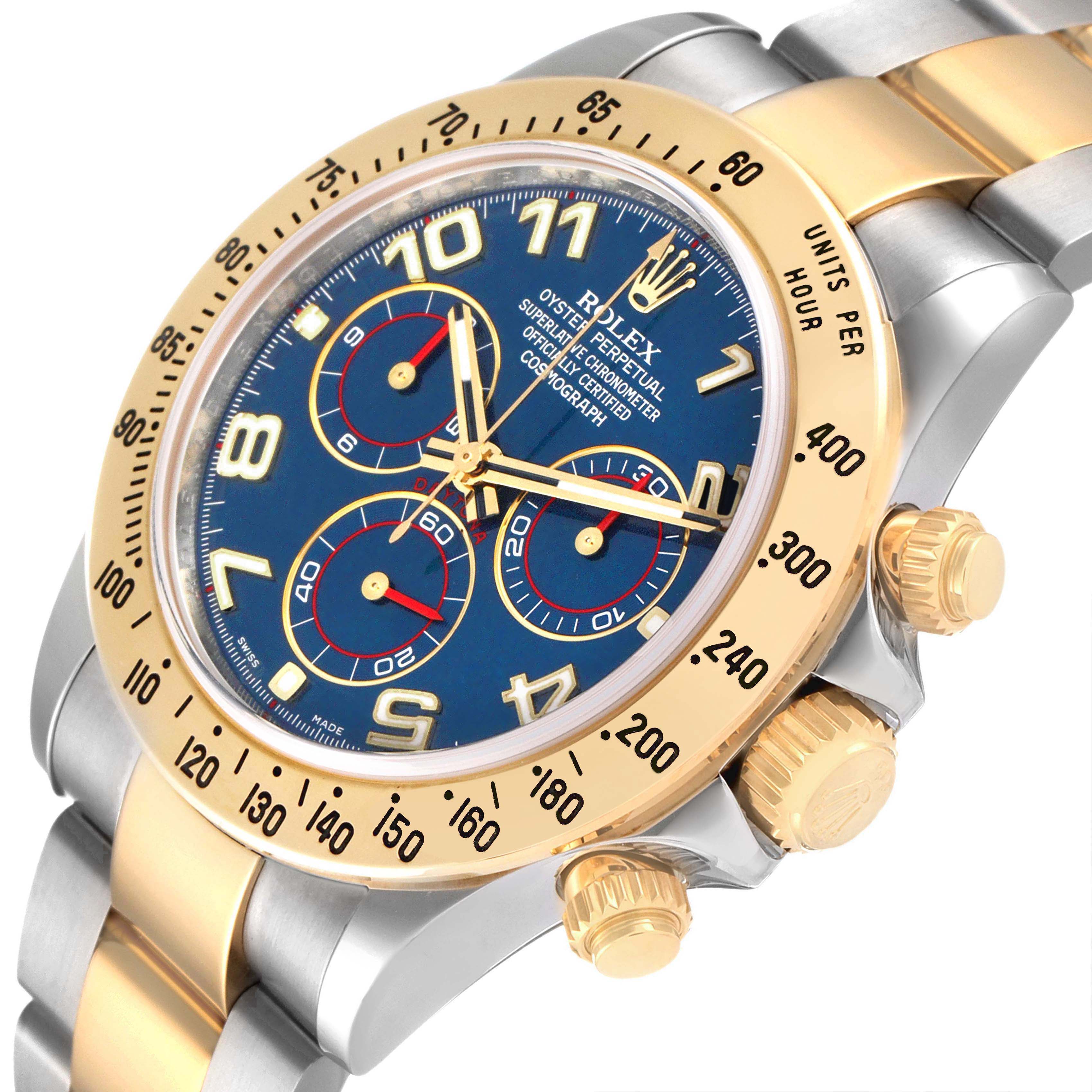 The Rolex Daytona 116523 Men's Steel and Gold (two tone) Blue Dial watch is shown from an angled view, highlighting its bezel, dial, and side pushers.