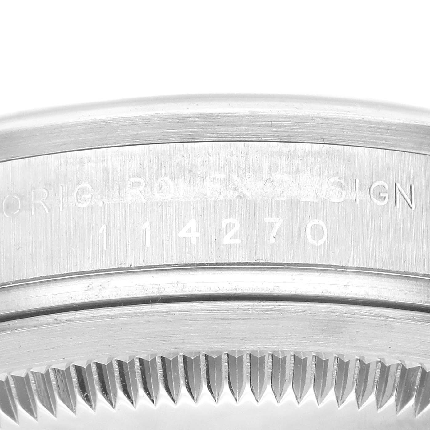 The image shows a close-up of the serial number and bezel edge of a Rolex Explorer 114270 Men
s Stainless Steel Black Dial 114270 Men
s Stainless Steel Black Dial watch.