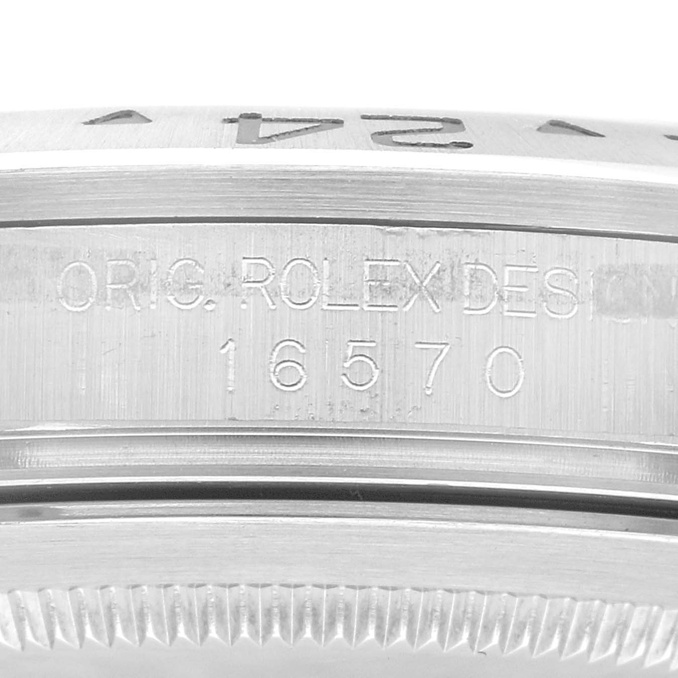 The image shows a close-up of the side of a Rolex Explorer 16570 Men
s Stainless Steel White Dial 16570 Men
s Stainless Steel White Dial watch case, displaying the model number "16570" engraved.