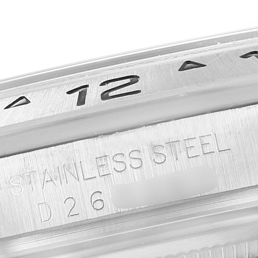 This image shows a close-up of the stainless steel bezel and serial number of a Rolex Explorer 16570 Men
s Stainless Steel Black Dial 16570 Men
s Stainless Steel Black Dial watch.