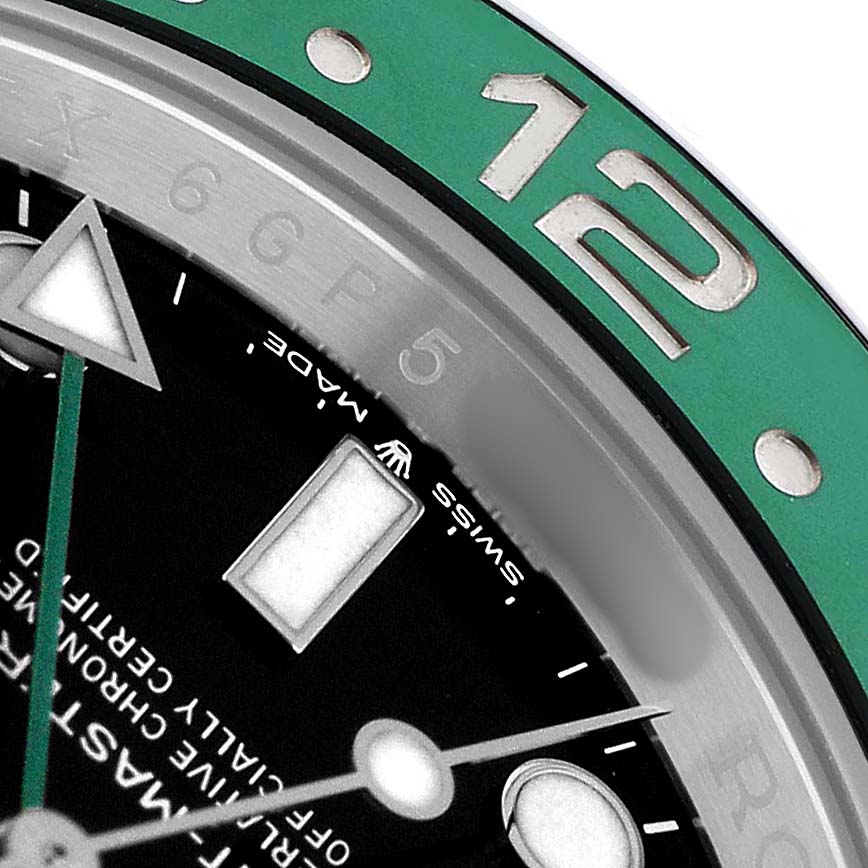 The image shows a close-up of the Rolex GMT-Master 126720VTNR Men's Stainless Steel Black Dial watch, focusing on the dial, bezel, and partial markers.