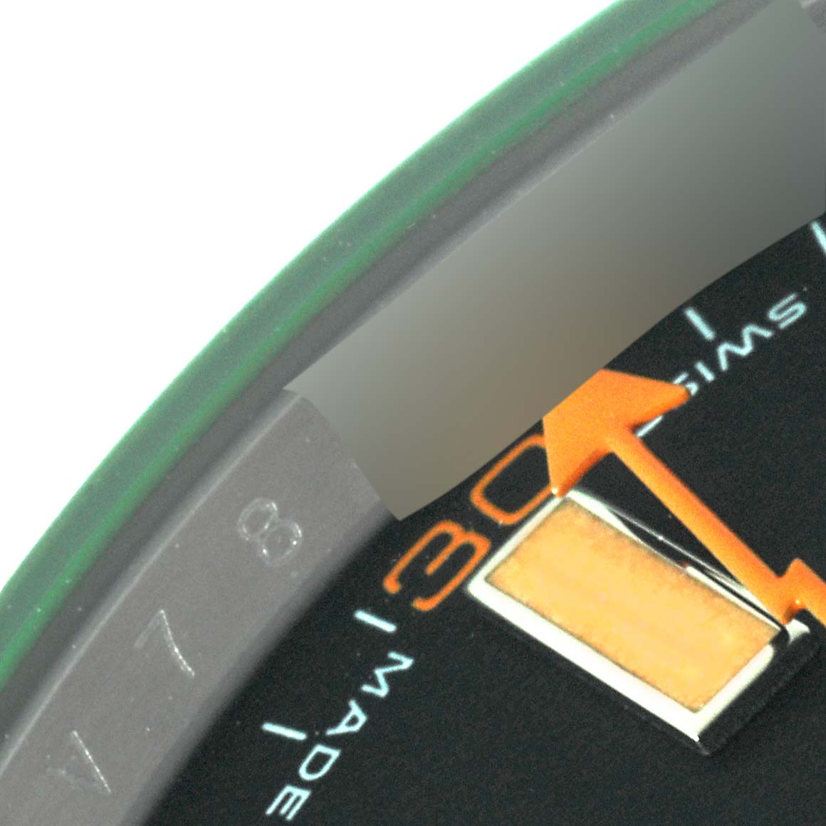 The image shows a close-up of the dial of a Rolex Milgauss 116400GV Men's Stainless Steel Black Dial 116400GV Men's Stainless Steel Black Dial watch, highlighting the orange second hand and part of the 3 o'clock marker.