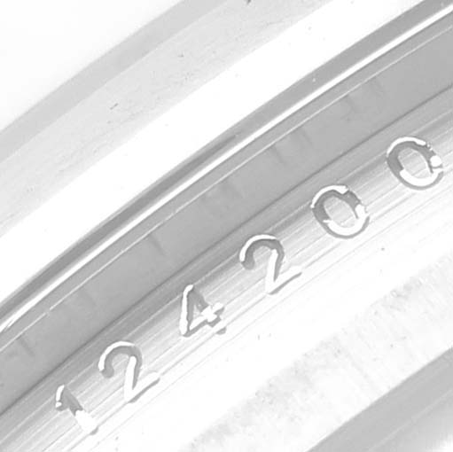 This close-up image of the Rolex Oyster Perpetual 124200 Men
s Stainless Steel Blue Dial 124200 Men
s Stainless Steel Blue Dial watch shows the engraved model number, 124200, on the inner bezel.