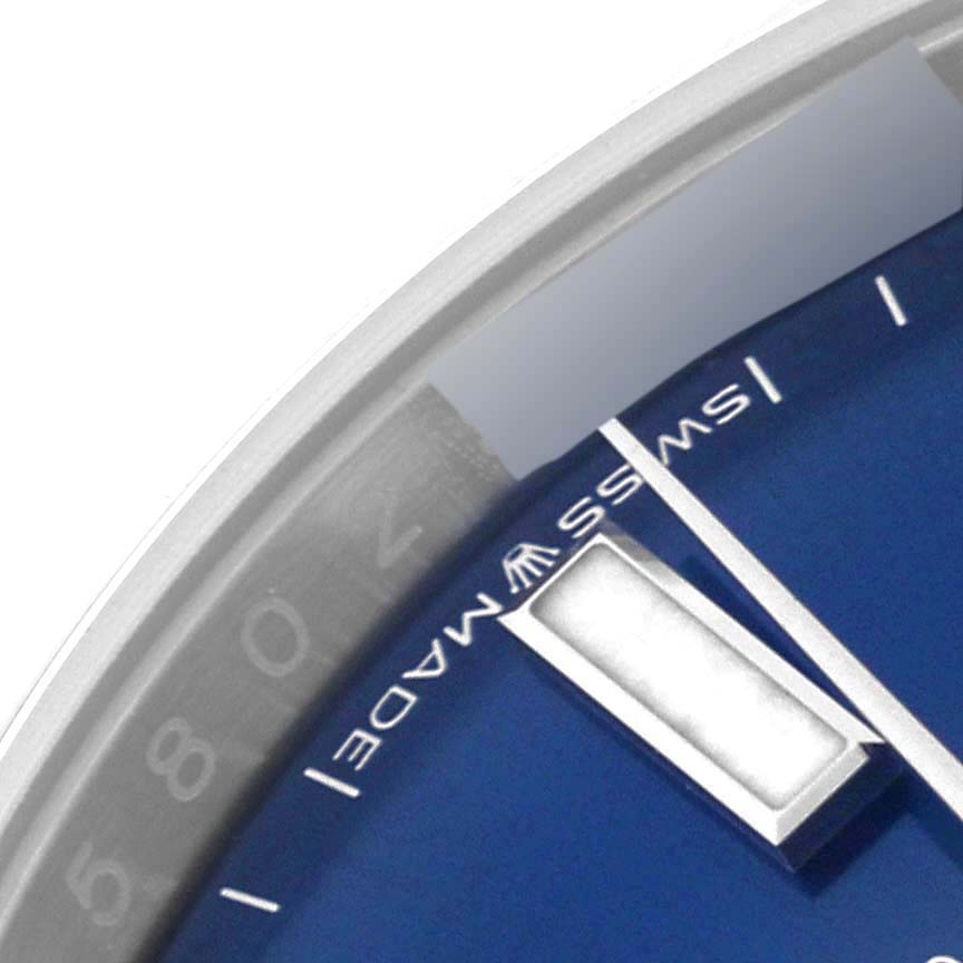 This close-up image shows a portion of the dial face and markers of the Rolex Oyster Perpetual 124200 Men
s Stainless Steel Blue Dial 124200 Men
s Stainless Steel Blue Dial.