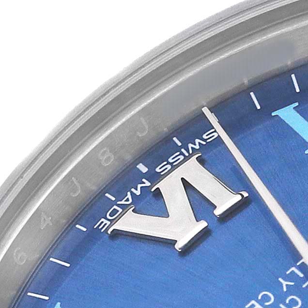 The image shows a close-up of the Rolex Oyster Perpetual 177200 Women's Stainless Steel Blue Dial watch, highlighting the dial and hour markers.
