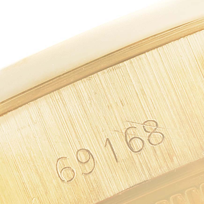 This image shows a close-up of the serial number 69168 engraved on the case of a Rolex President 69168 Women's Yellow Gold Champagne Dial 69168 Women's Yellow Gold Champagne Dial model watch.