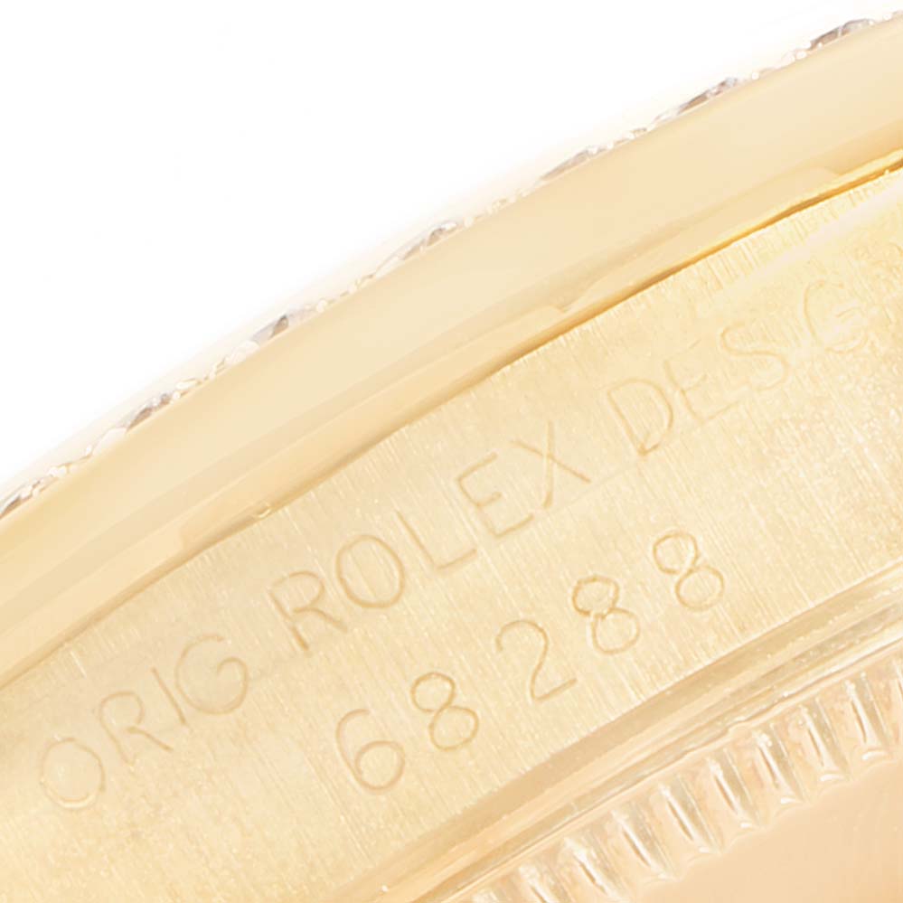 The image shows a close-up of the engraved case back rim of a Rolex President 68288 Women
s White Gold Champagne Dial 68288 Women
s White Gold Champagne Dial model, displaying part of the serial number.