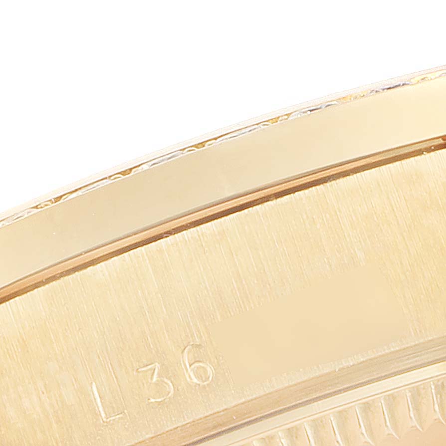 This is a close-up view of the outer edge and engraved serial number of a Rolex President 68288 Women
s White Gold Champagne Dial 68288 Women
s White Gold Champagne Dial watch.