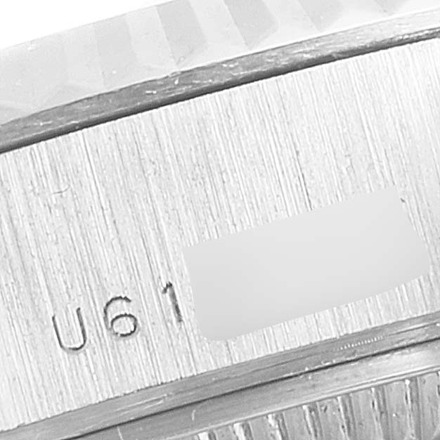 This image shows a close-up of the serial number engraving on the case of a Rolex President 69179 Women's White Gold Blue Dial 69179 Women's White Gold Blue Dial model watch.