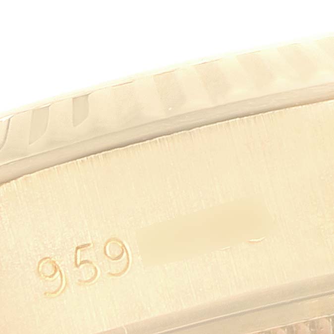 This image shows a close-up of the outer edge of the Rolex President 69178 Women's Yellow Gold Champagne Dial 69178 Women's Yellow Gold Champagne Dial model, highlighting its engraved serial number.