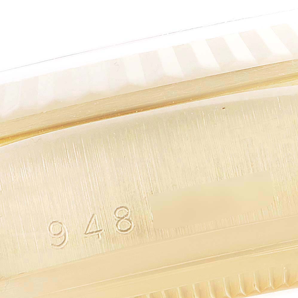 This close-up image shows the side of a Rolex President 18038 Men's Yellow Gold Champagne Dial 18038 Men's Yellow Gold Champagne Dial model watch, highlighting the engraved serial or model number.