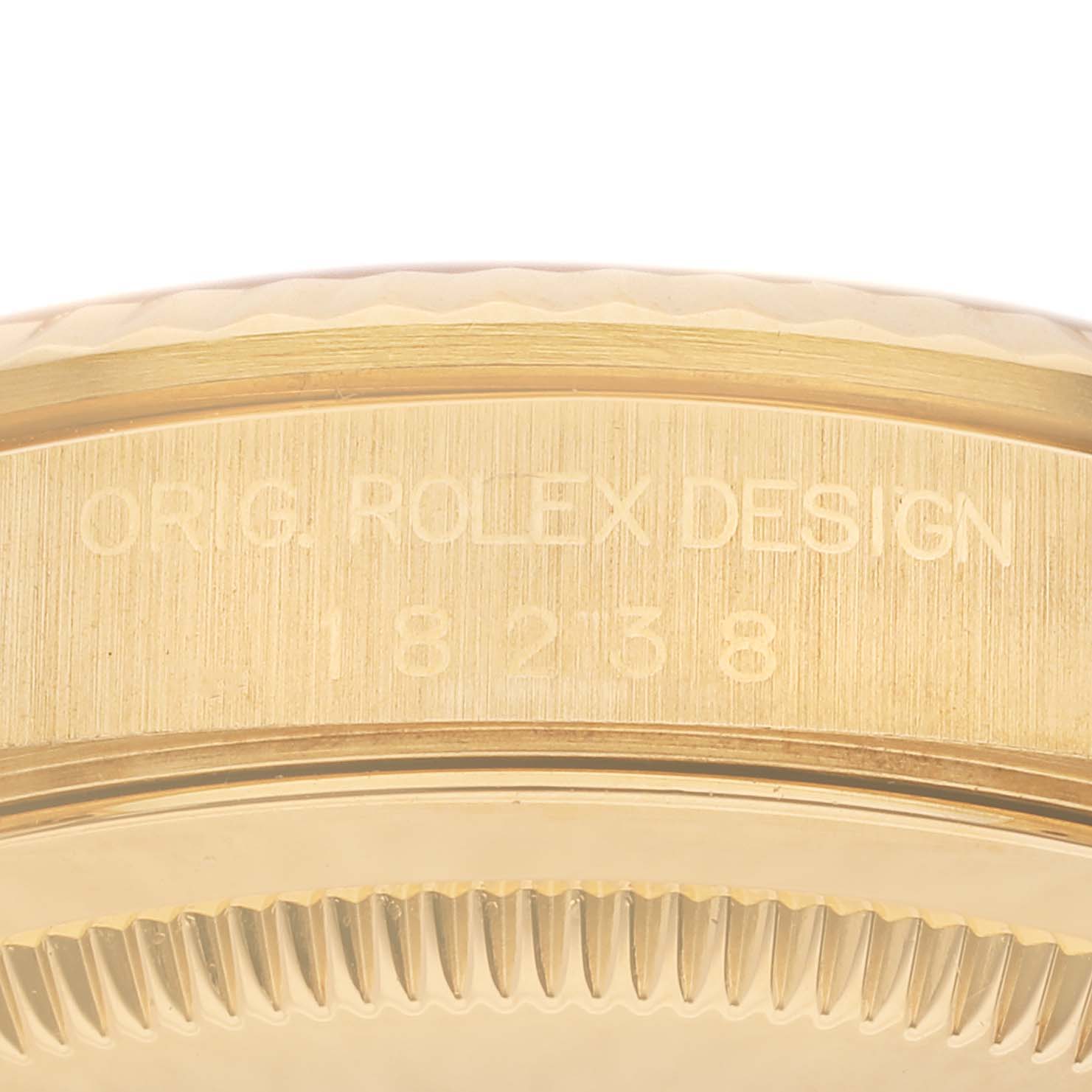 The image shows a close-up of the serial number engraving on the side of a Rolex President 18238A Men
s Yellow Gold Champagne Dial 18238A Men
s Yellow Gold Champagne Dial model case.