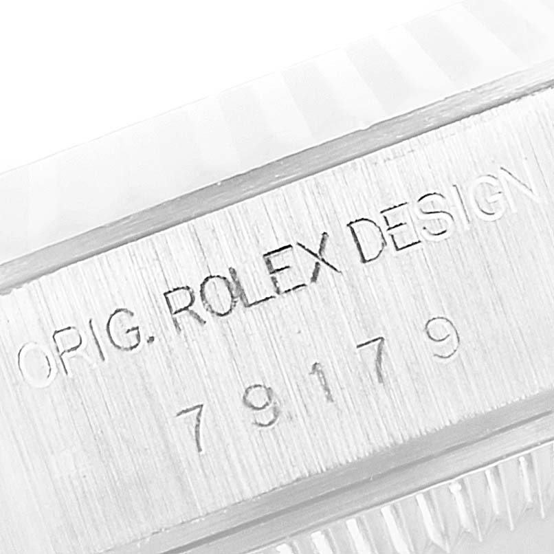 The image shows a close-up of the engraving on the side of a Rolex President 79179 Women's White Gold Silver Dial 79179 Women's White Gold Silver Dial model watch.