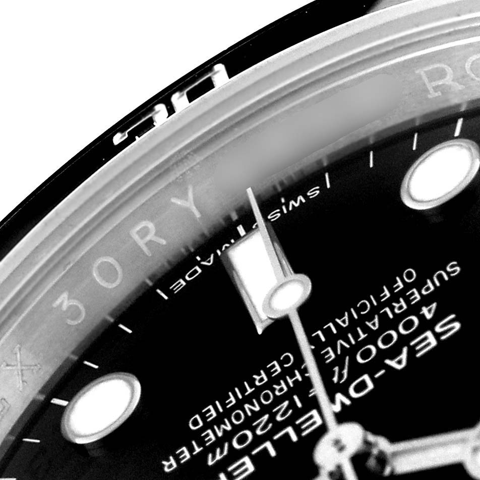 The image shows a close-up of the dial and part of the bezel of a Rolex Sea-Dweller 116600 Men
s Stainless Steel Black Dial 116600 Men
s Stainless Steel Black Dial watch.