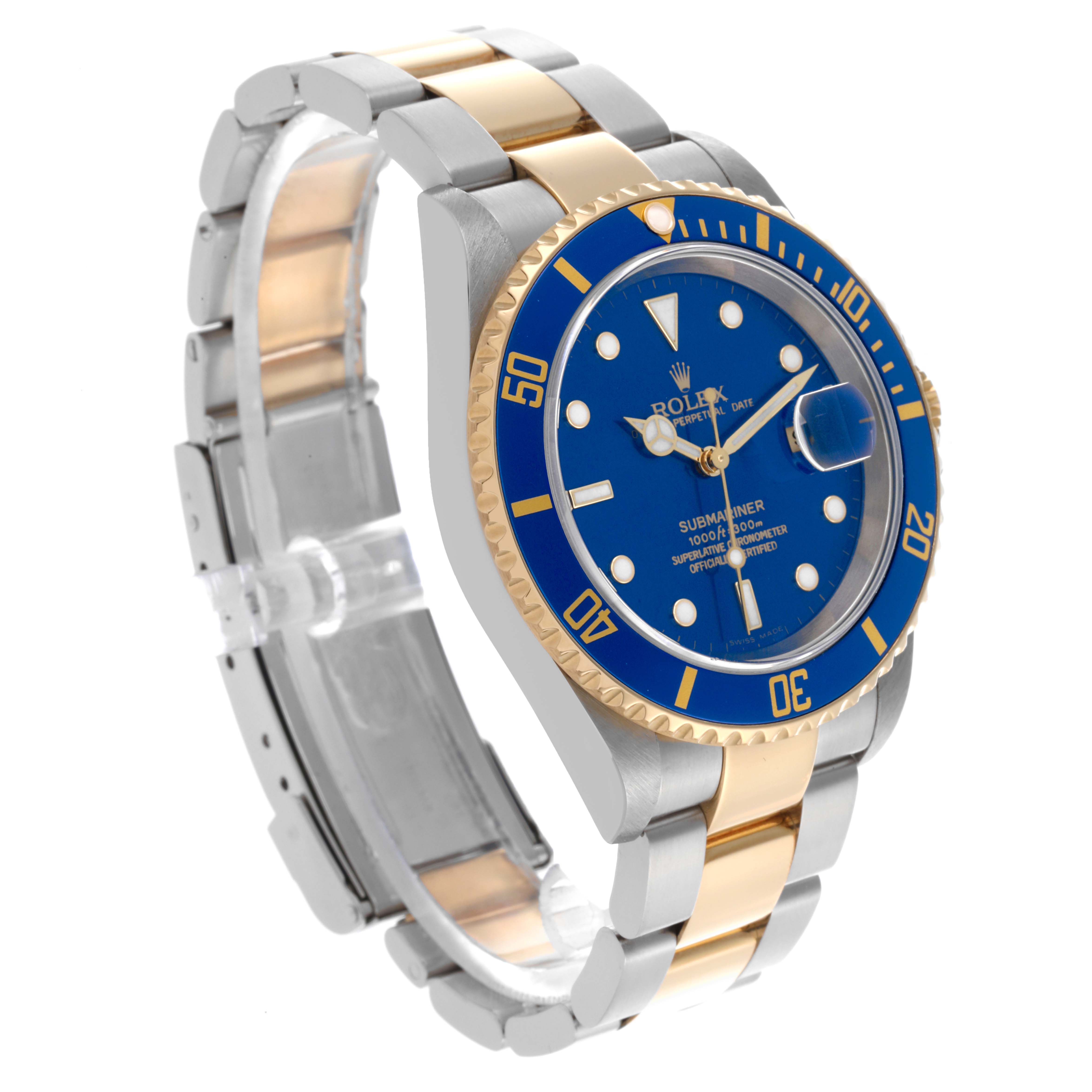 The Rolex Submariner 16613 Men's Steel and Gold (two tone) Blue Dial 16613 Men's Steel and Gold (two tone) Blue Dial watch is shown at a three-quarter angle, highlighting the blue dial, ceramic bezel, and two-tone bracelet.