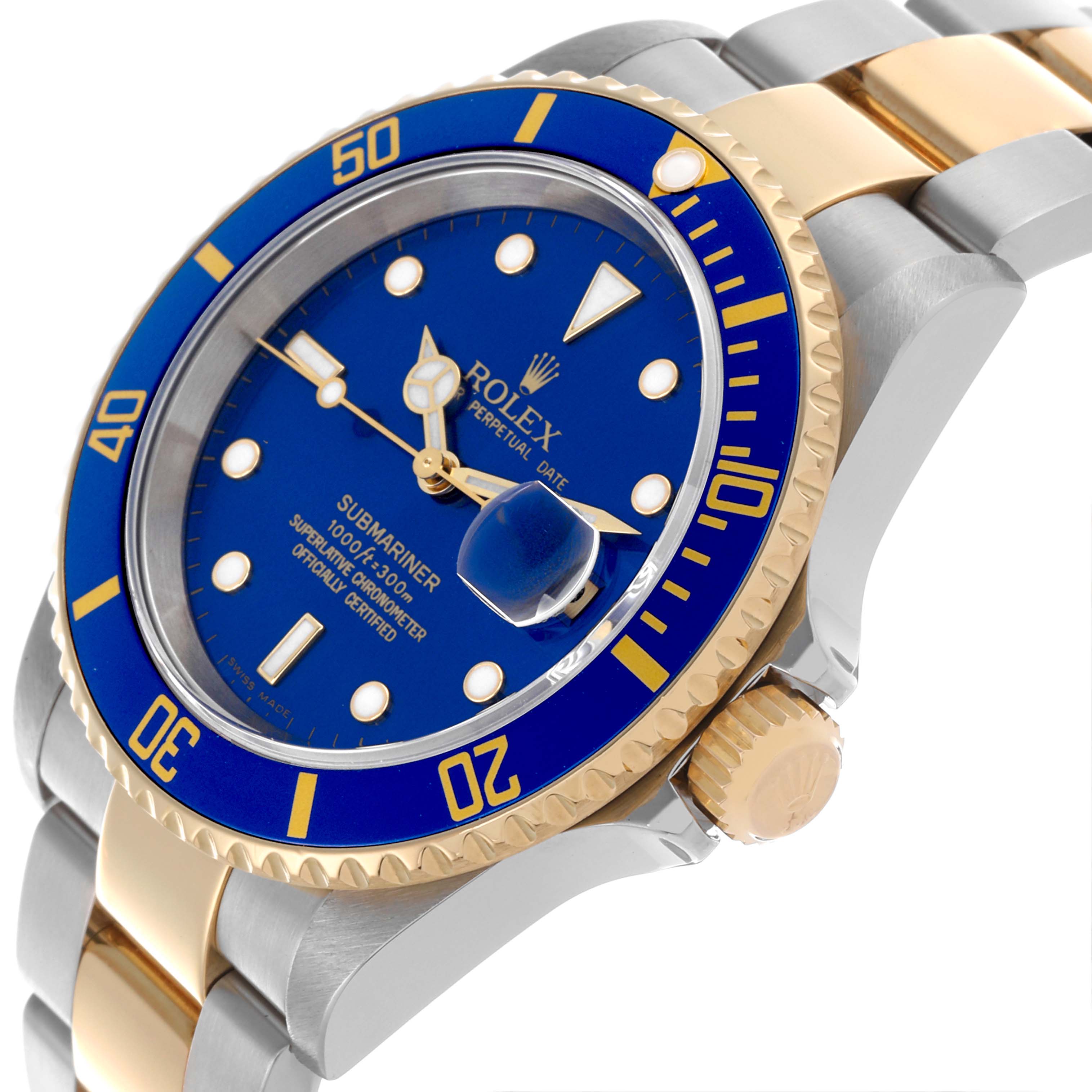 The image shows a Rolex Submariner 16613 Men's Steel and Gold (two tone) Blue Dial 16613 Men's Steel and Gold (two tone) Blue Dial watch from a three-quarter angle, highlighting the blue dial, gold bezel, and two-tone bracelet.