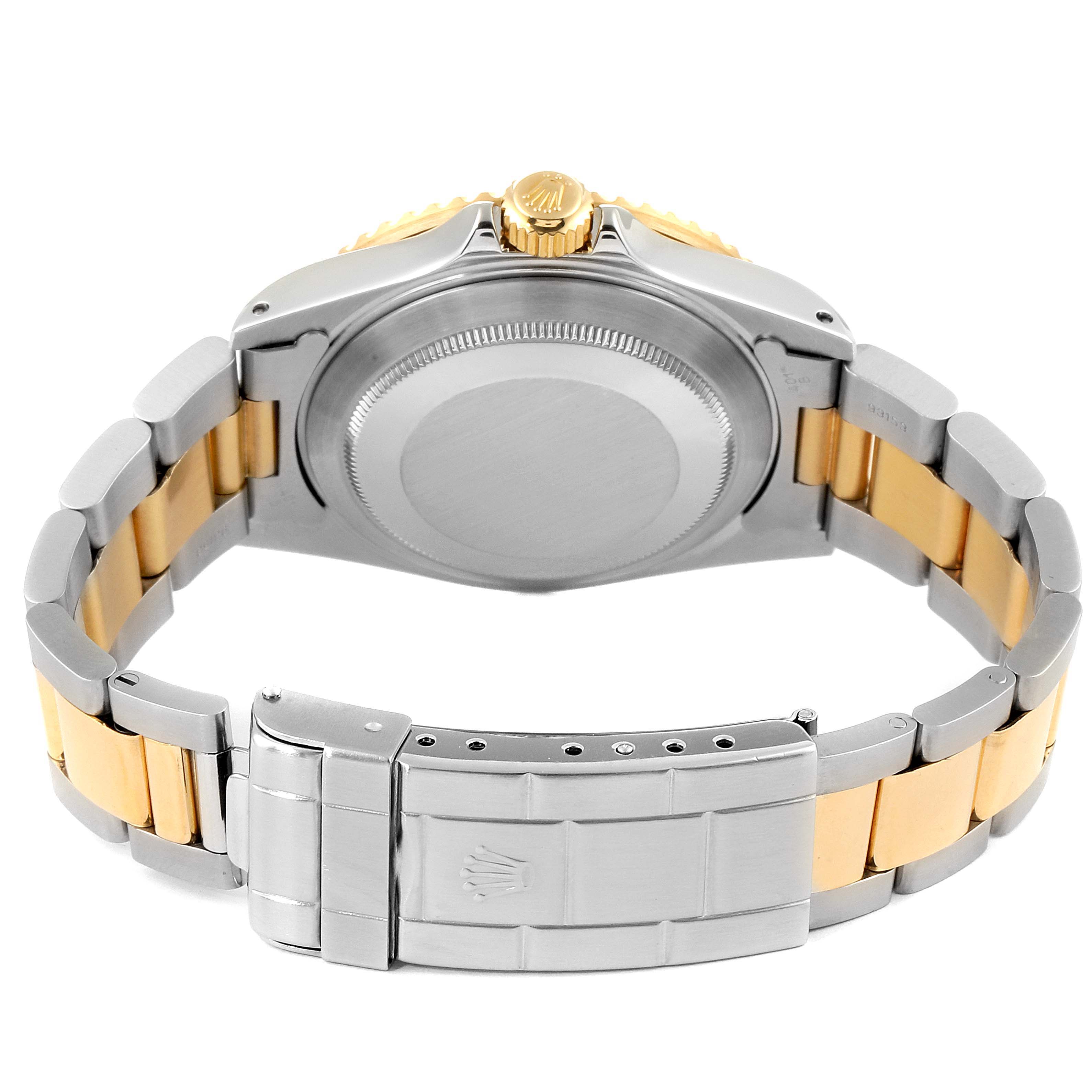 The image shows the back case and bracelet of a Rolex Submariner 16613 Men
s Steel and Gold (two tone) Blue Dial 16613 Men
s Steel and Gold (two tone) Blue Dial, highlighting the clasp and crown.