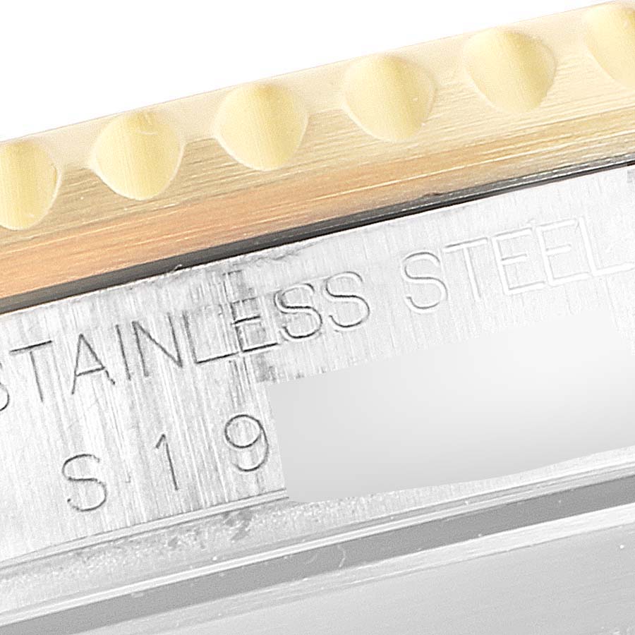 This image shows a close-up of the etched model markings and part of the bezel of a Rolex Submariner 16613 Men
s Steel and Gold (two tone) Blue Dial 16613 Men
s Steel and Gold (two tone) Blue Dial watch.