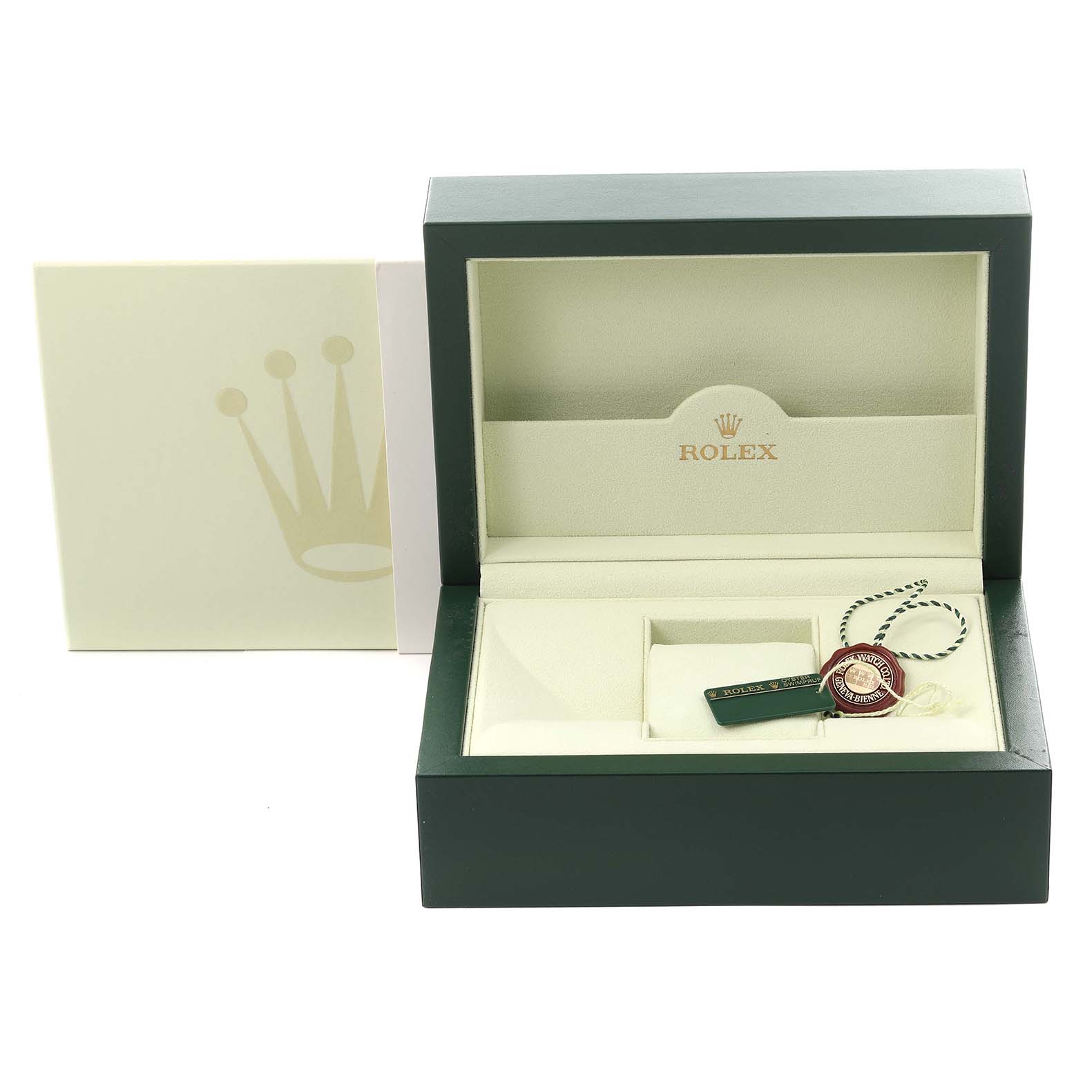 The image shows an open green Rolex box for the Submariner model, displaying the interior and some accessories.