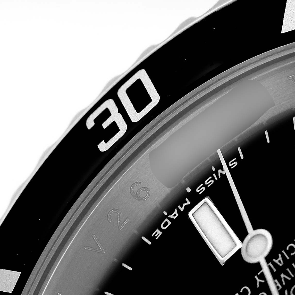 The image shows a close-up of the Rolex Submariner 16610 Men's Stainless Steel Black Dial's dial, focusing on the bezel, markers, and part of the hand.