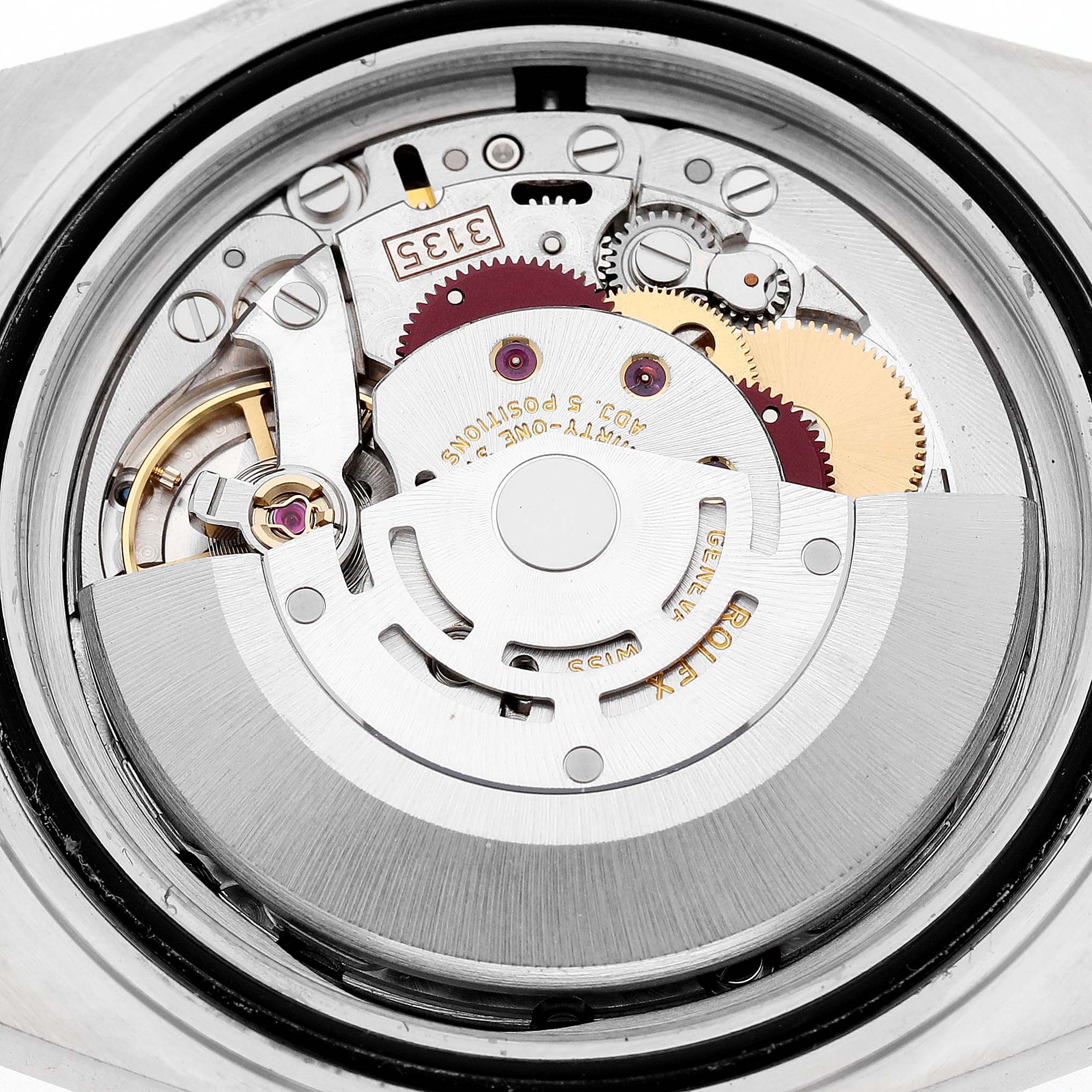 The image shows the movement of a Rolex Submariner 16610 Men's Stainless Steel Black Dial from the back, highlighting gears and mechanical components.