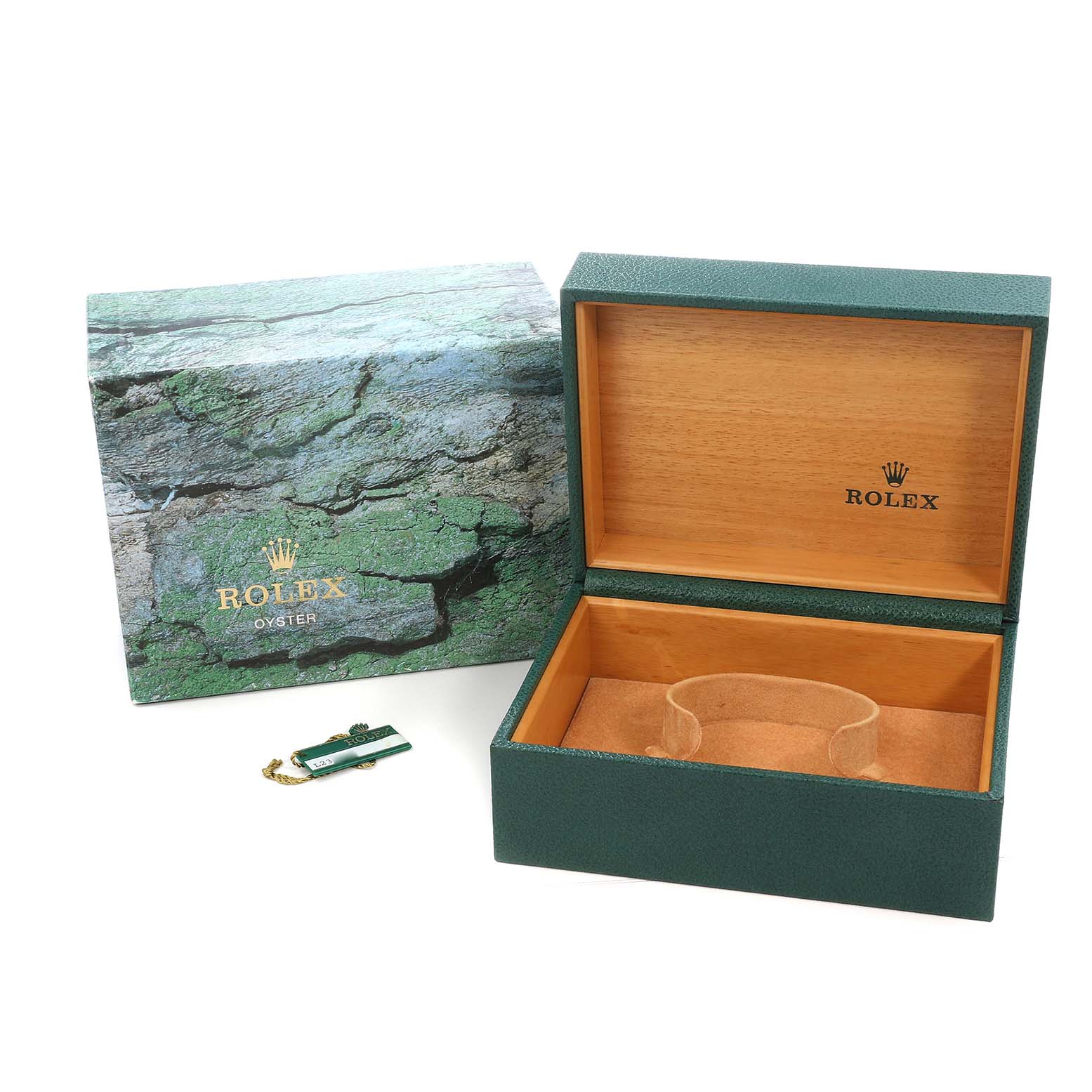 The image shows the open box and packaging for a Rolex Submariner 16610 Men's Stainless Steel Black Dial watch, including the manufacturer's tag.