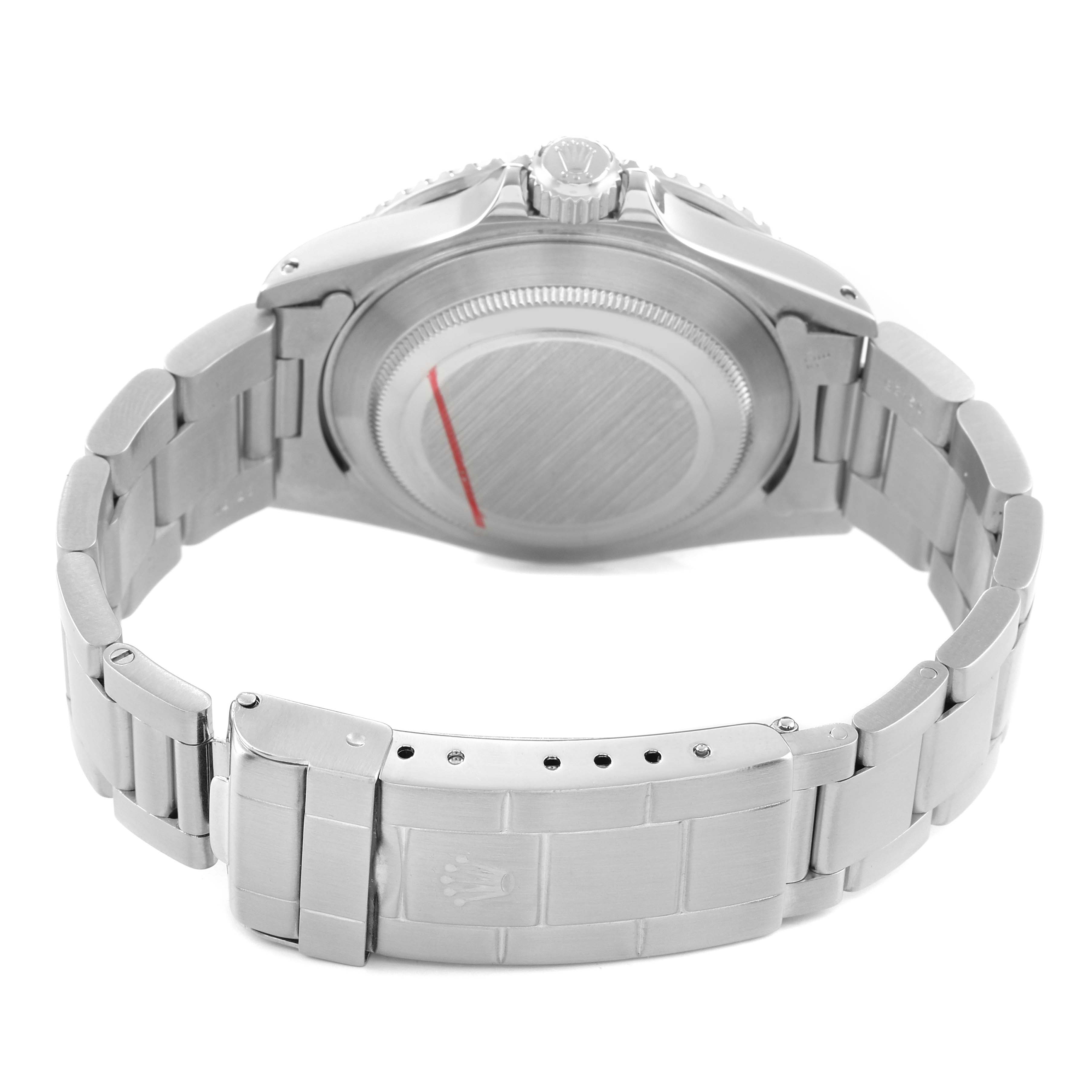 The image shows the back view of a Rolex Submariner 16610 Men's Stainless Steel Black Dial, highlighting the case back, crown, and bracelet with the clasp open.