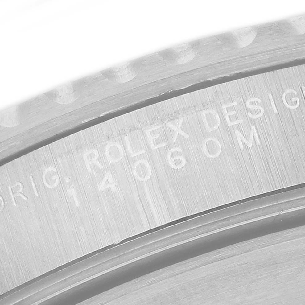 The image shows the engraved inner bezel of a Rolex Submariner 14060 Men's Stainless Steel Black Dial, displaying the model number "14060M".
