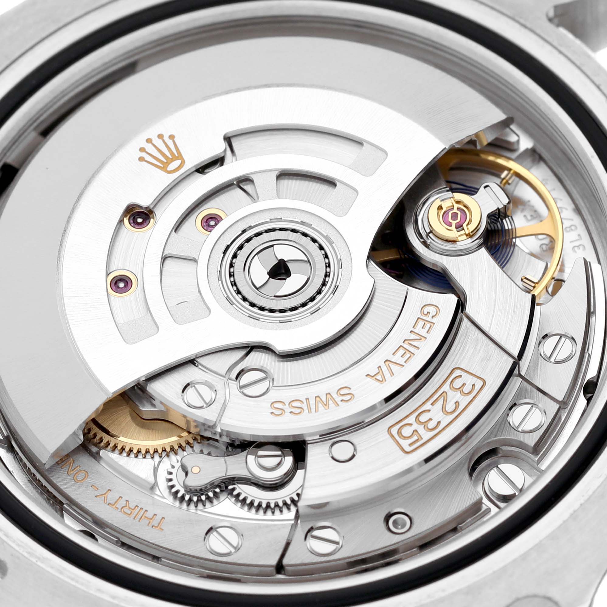 The image shows the movement mechanism of a Rolex Submariner 126610LV Men
s Stainless Steel Black Dial 126610LV Men
s Stainless Steel Black Dial watch, viewed from the back.
