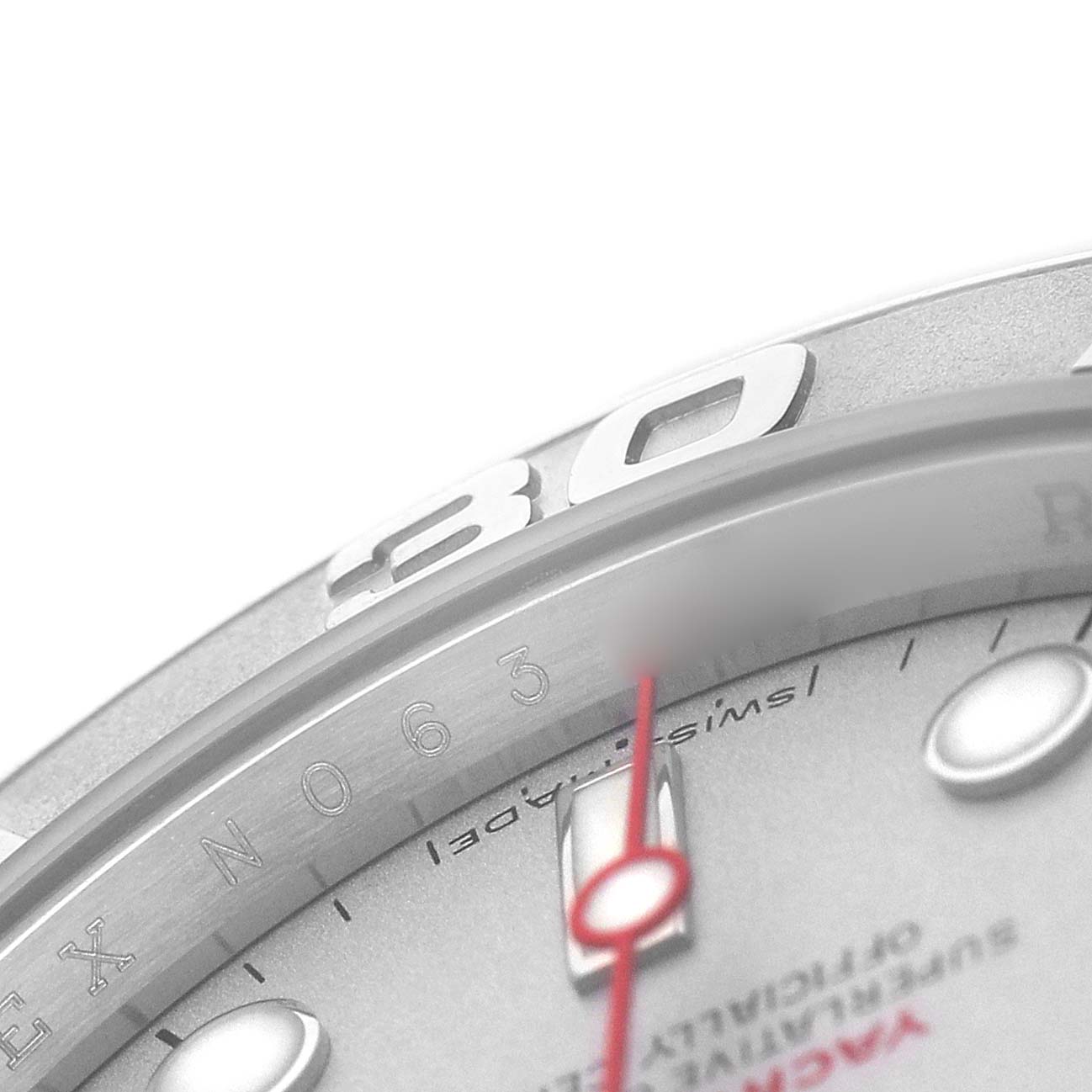 The image shows a close-up of the Rolex Yacht-Master 16622 Men's Stainless Steel Silver Dial's bezel and dial, highlighting the 30-minute marker and small dial text.