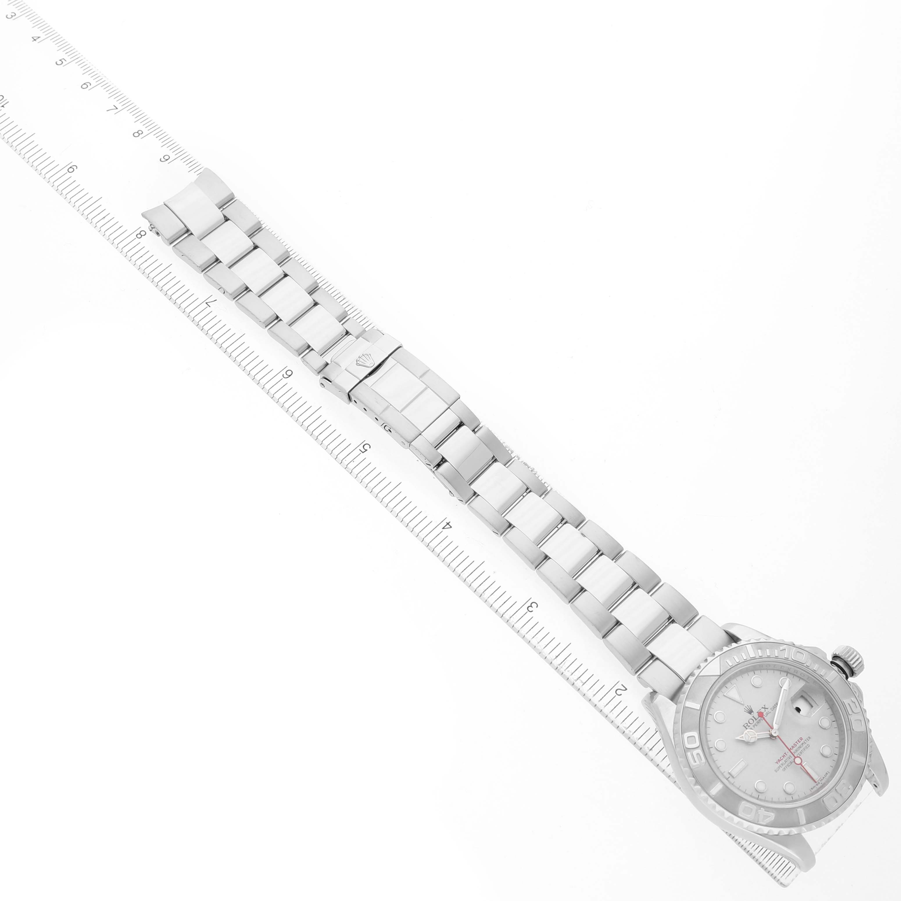 The Rolex Yacht-Master 16622 Men's Stainless Steel Silver Dial watch is shown straight on with its bracelet laid out and a ruler for scale.