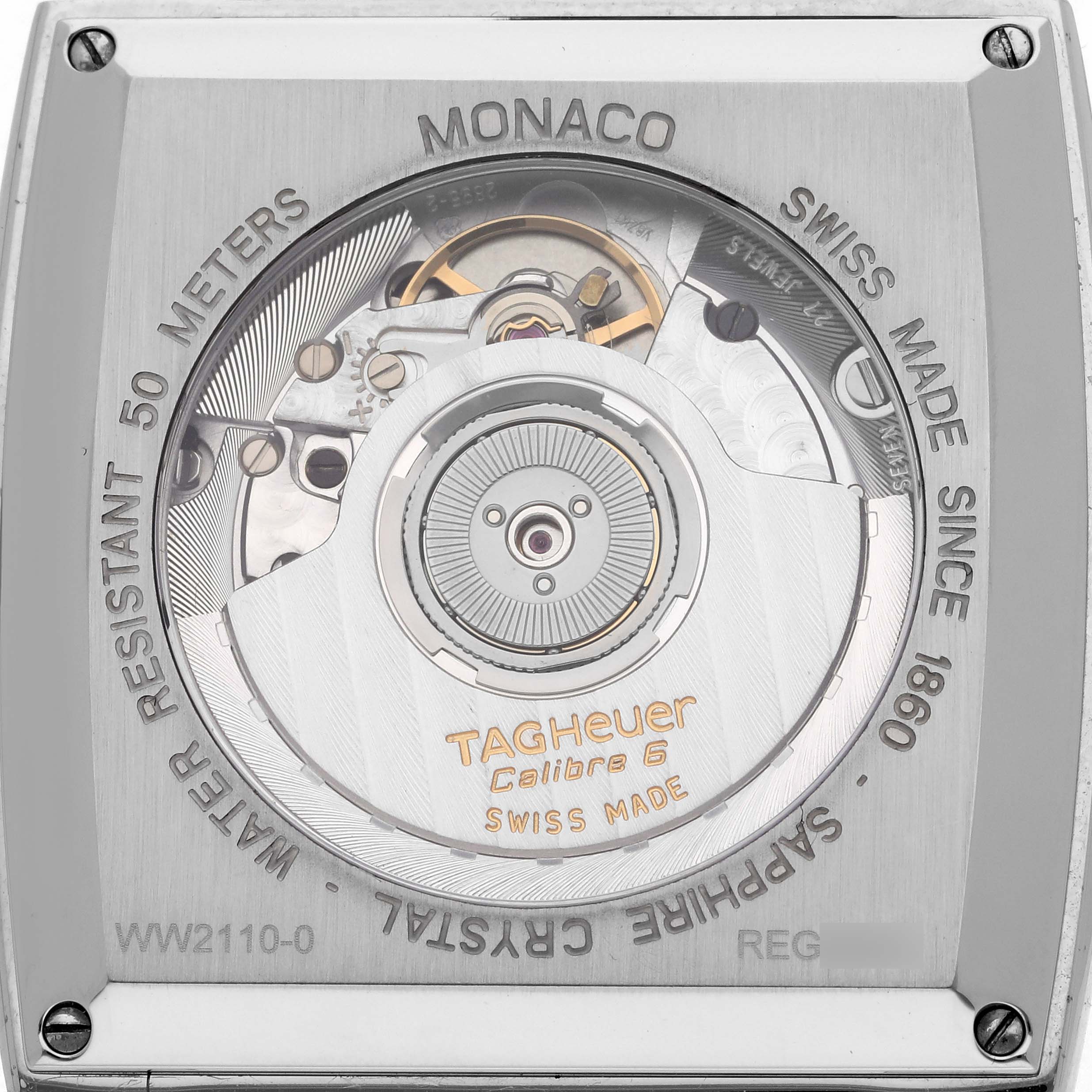 The image shows the back view of a Tag Heuer Monaco WW2110.FC6177 Men's Stainless Steel Black Dial WW2110.FC6177 Men's Stainless Steel Black Dial, highlighting the watch movement and inscriptions.