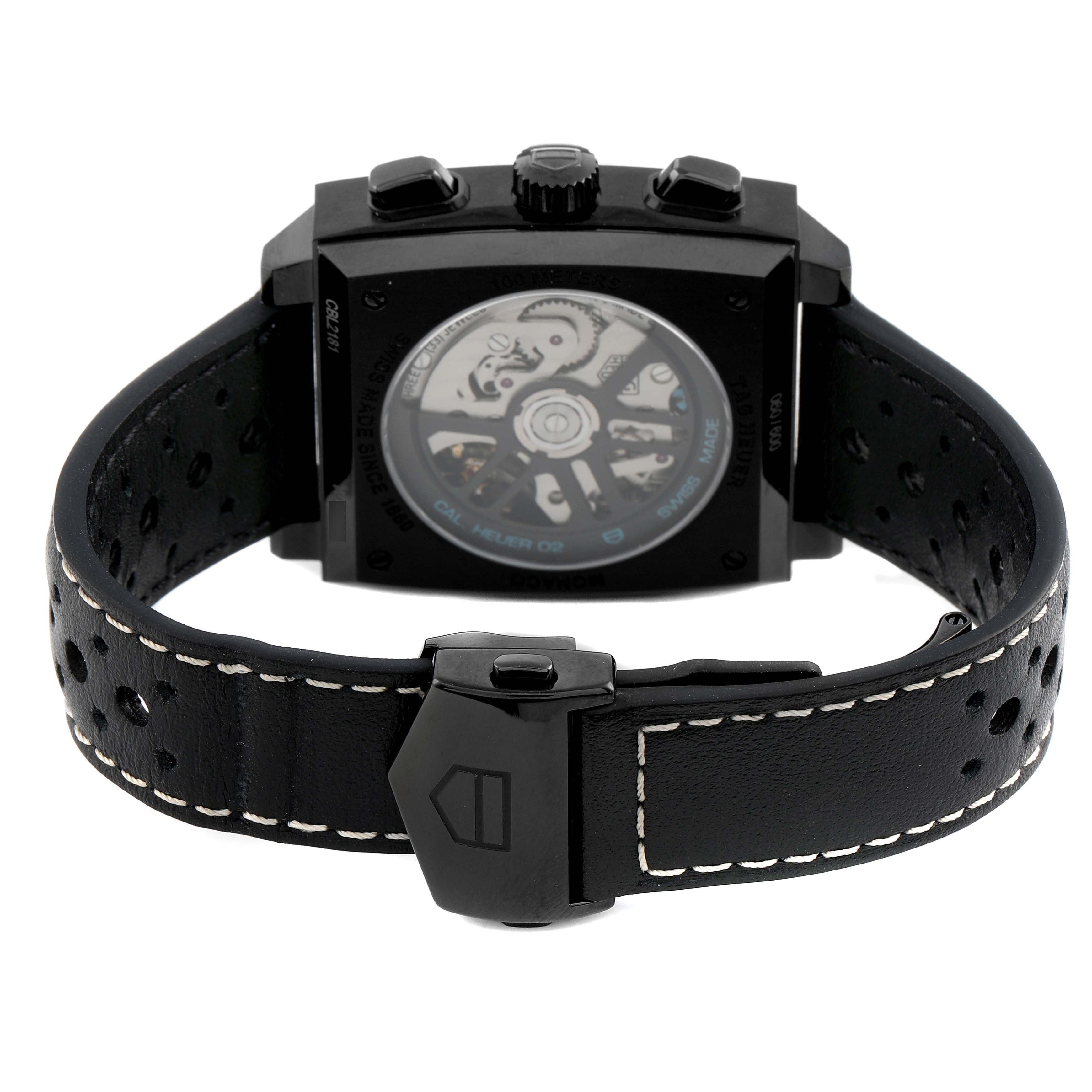 The Tag Heuer Monaco CBL2181 Men's Titanium Grey Dial watch is shown from the back, highlighting the case back and strap, with the movement visible.