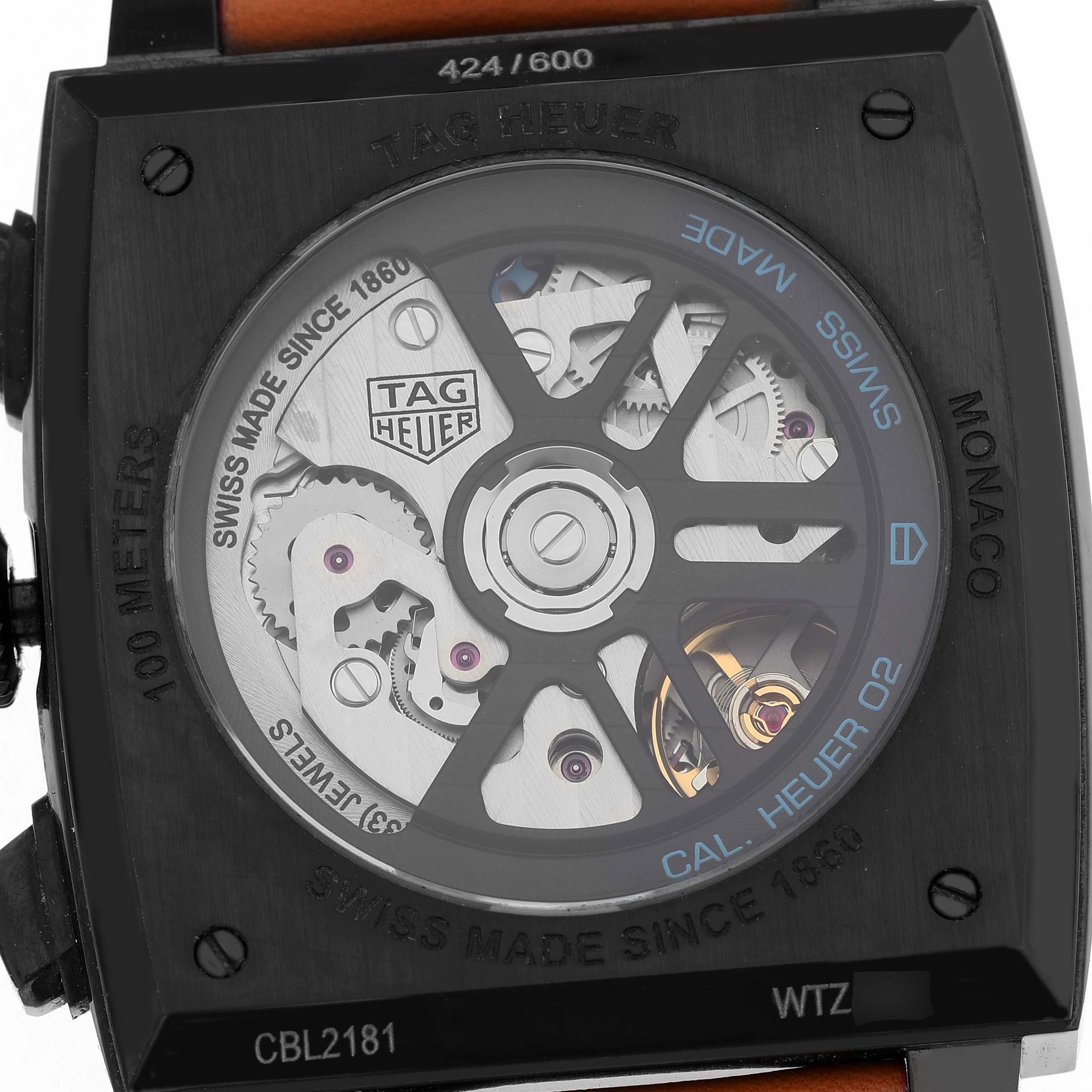 The image shows the back view of a Tag Heuer Monaco CBL2181 Men's Titanium Grey Dial watch, highlighting its mechanical movement.