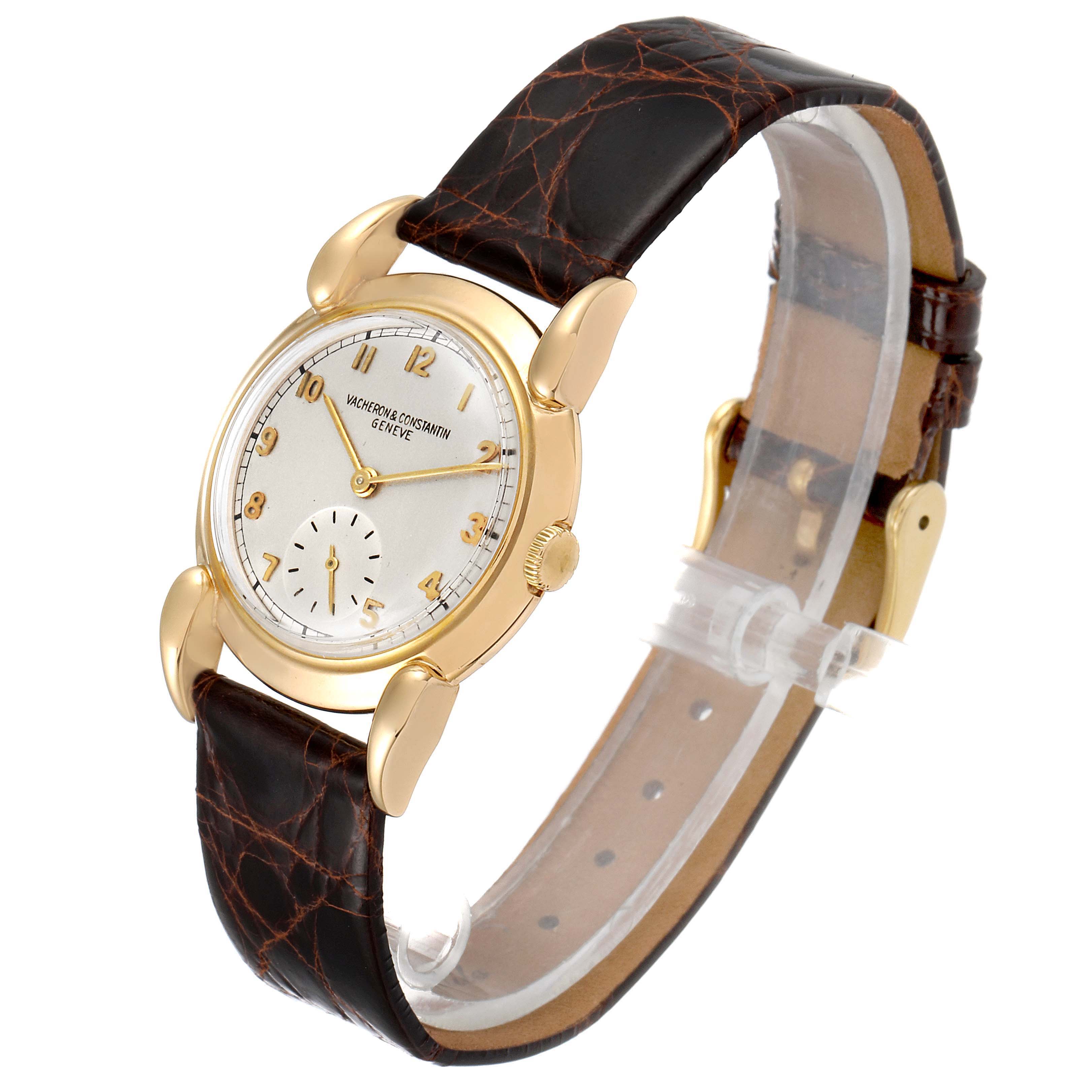 The image shows a Vacheron Constantin Vintage Women's Yellow Gold Silver Dial Women's Yellow Gold Silver Dial watch angled from the top-left side, featuring a gold case and a brown leather strap.