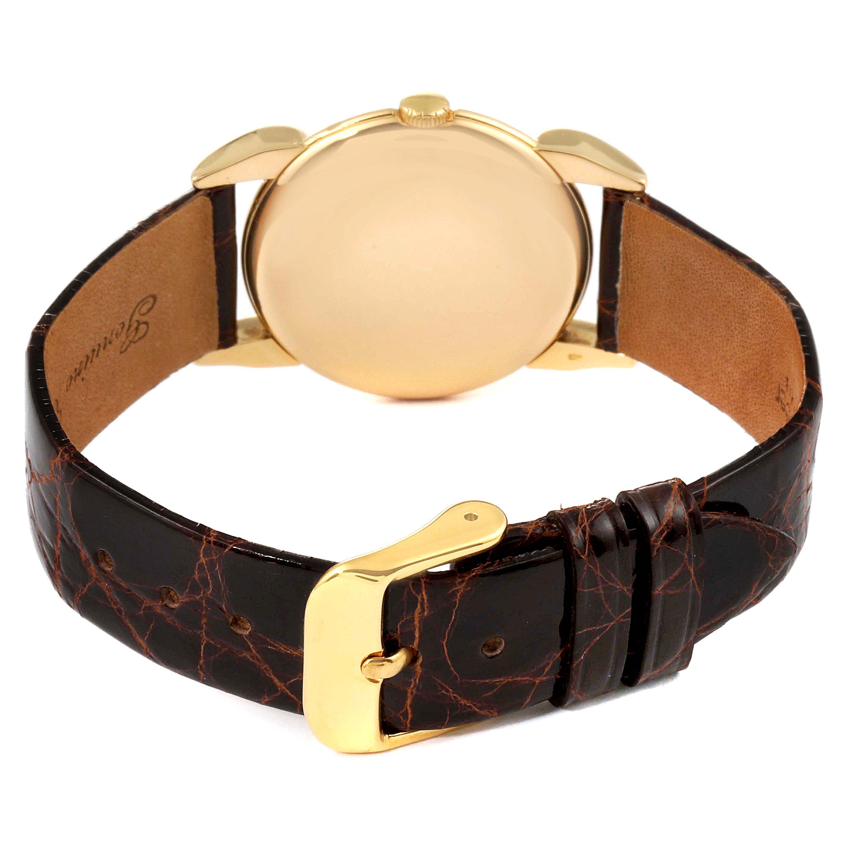 This image shows the back of a Vintage Vacheron Constantin watch with a leather strap and gold buckle.