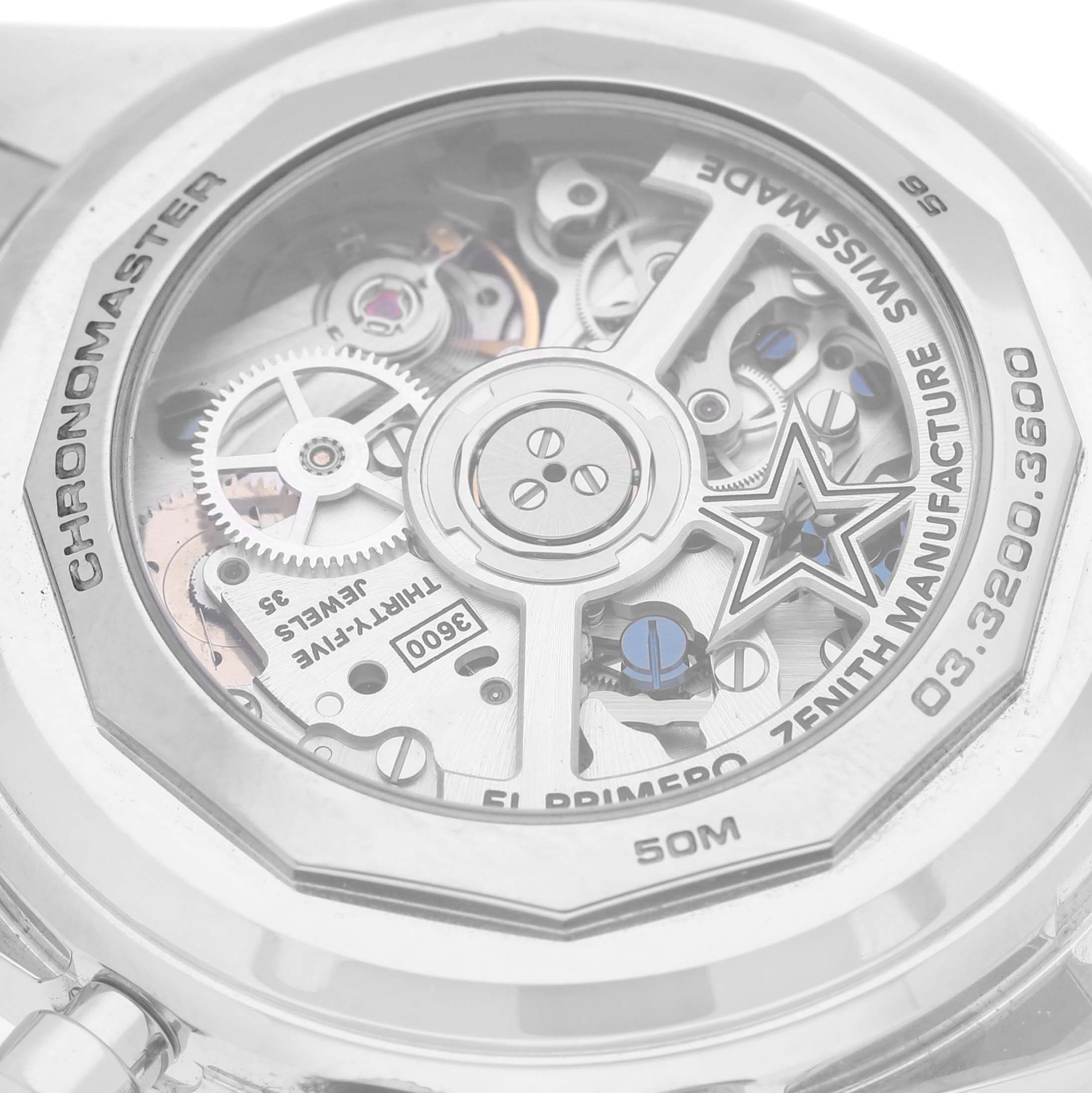 The image shows the back of the Zenith Chronomaster 03.3200.3600/21.C903 Men
s Stainless Steel Black Dial 03.3200.3600/21.C903 Men
s Stainless Steel Black Dial watch, highlighting its intricate movement and mechanical details.